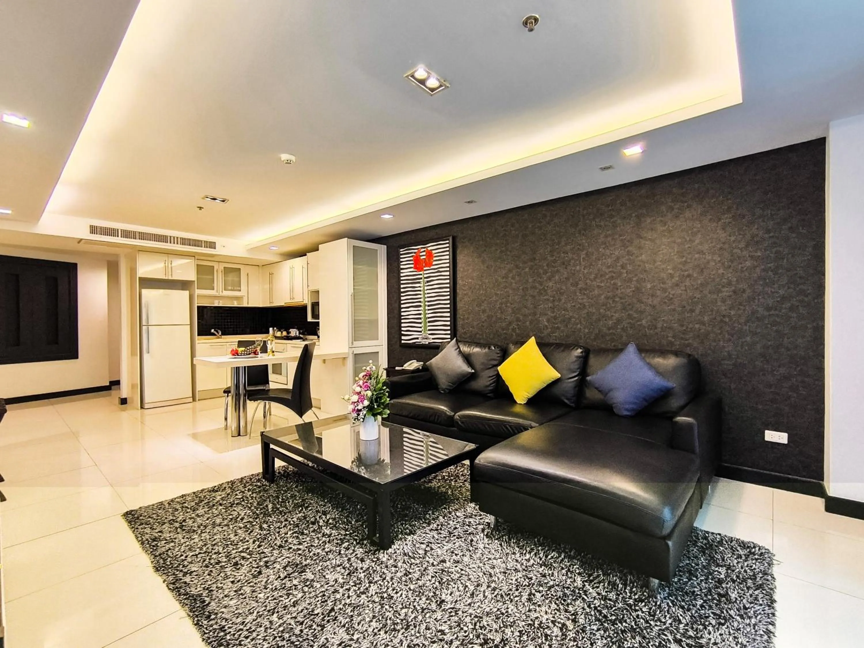 Living room in Nova Suites Pattaya by Compass Hospitality