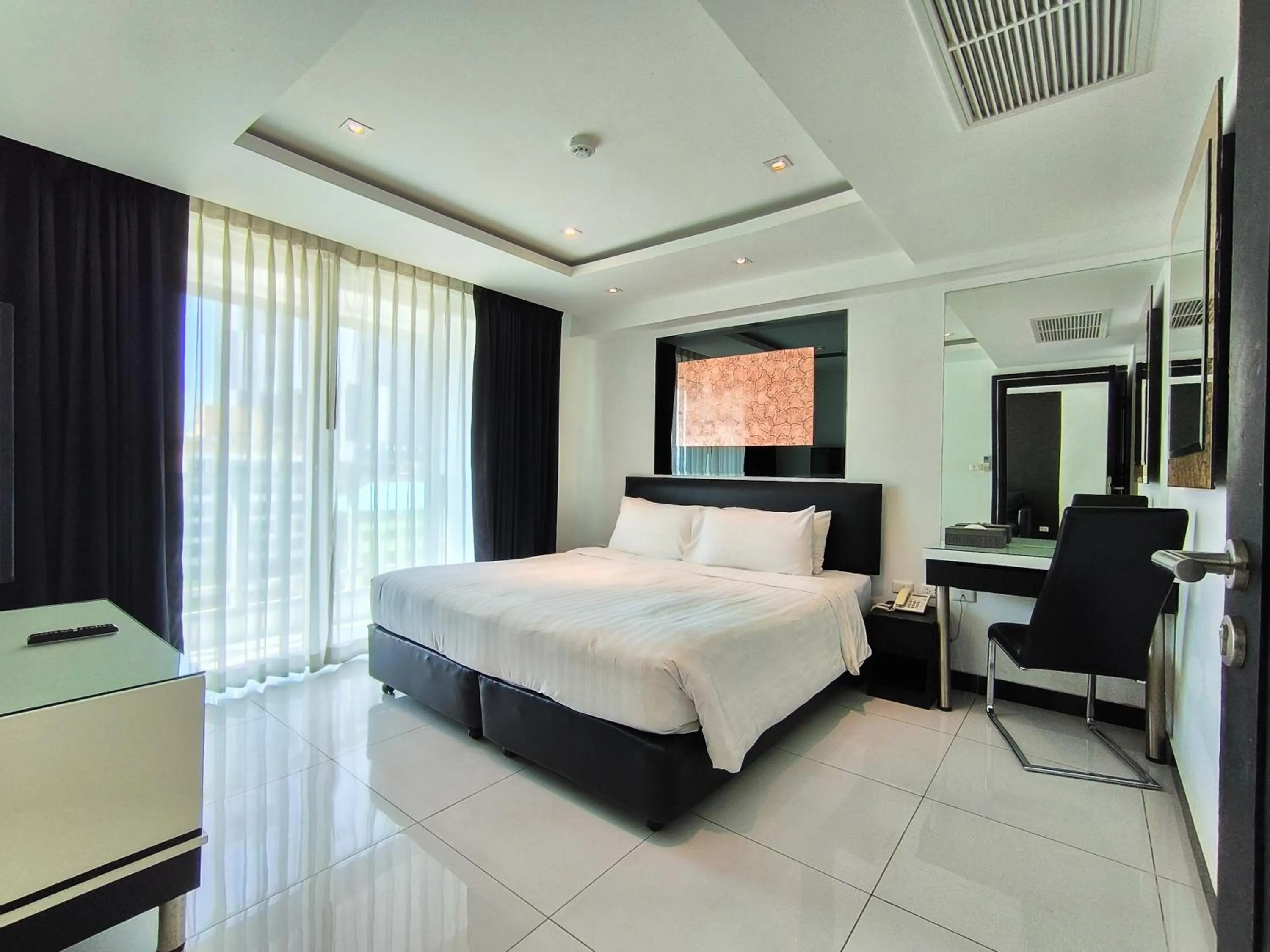 Bed in Nova Suites Pattaya by Compass Hospitality