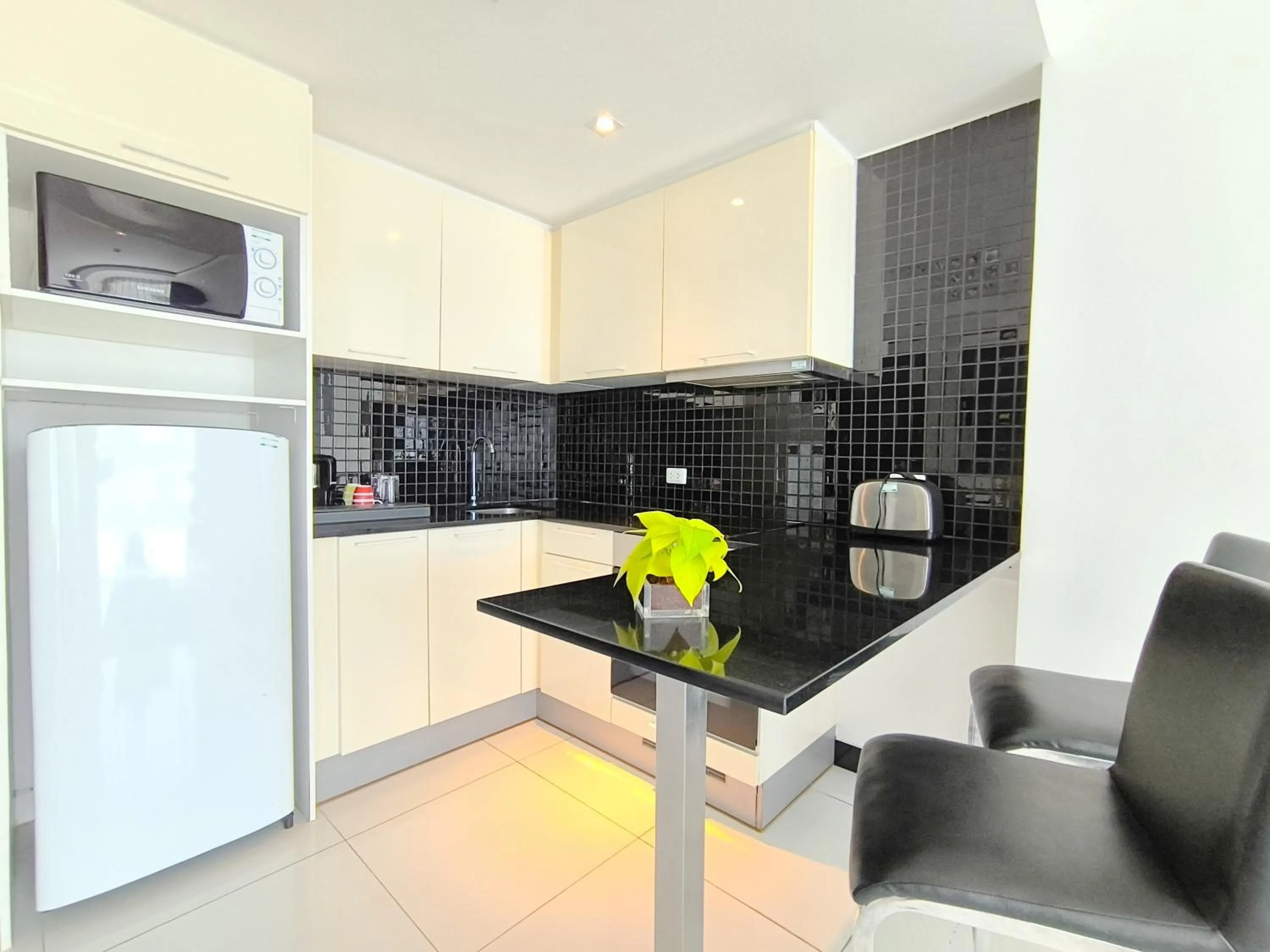 Kitchen or kitchenette in Nova Suites Pattaya by Compass Hospitality