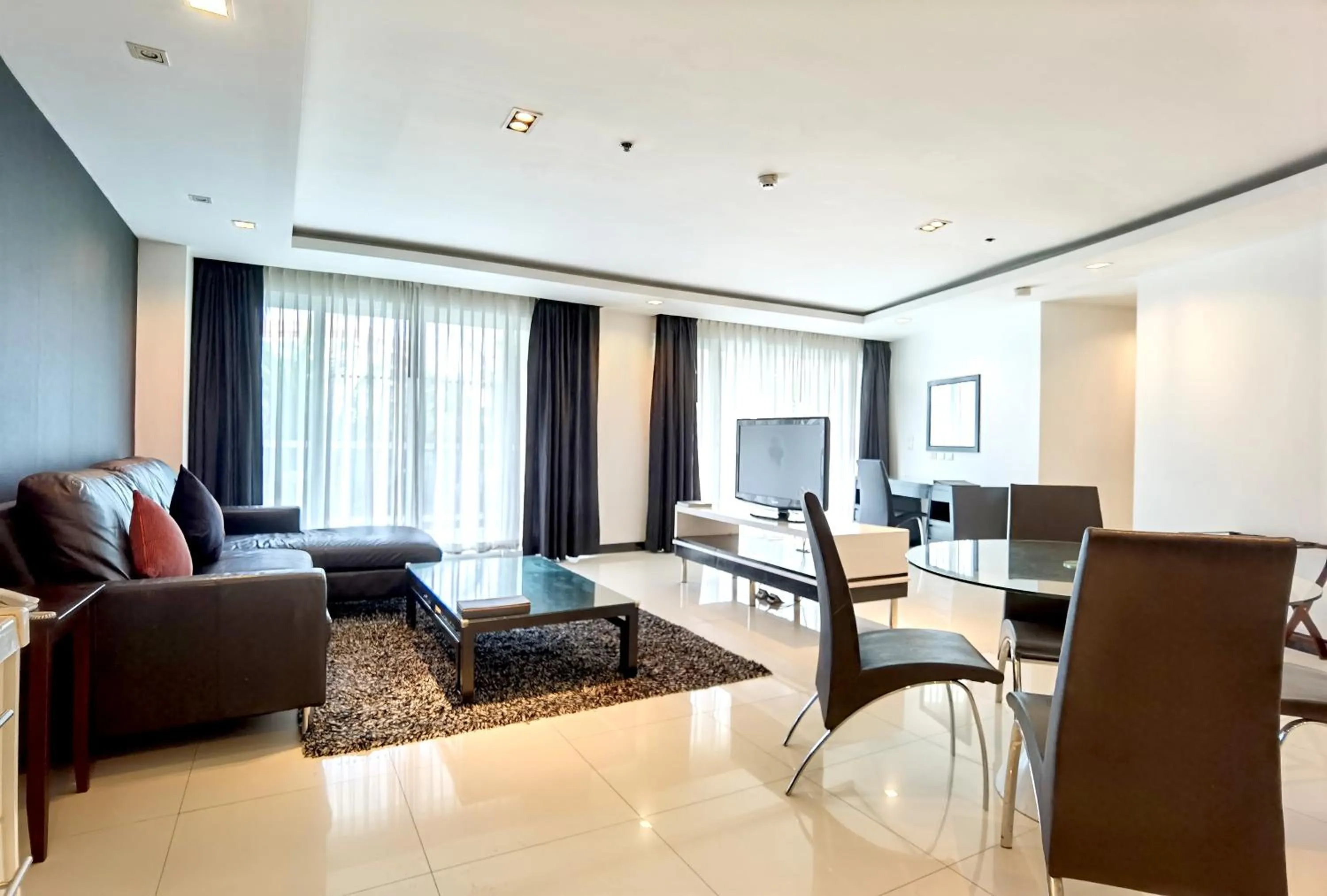 Living room in Nova Suites Pattaya by Compass Hospitality