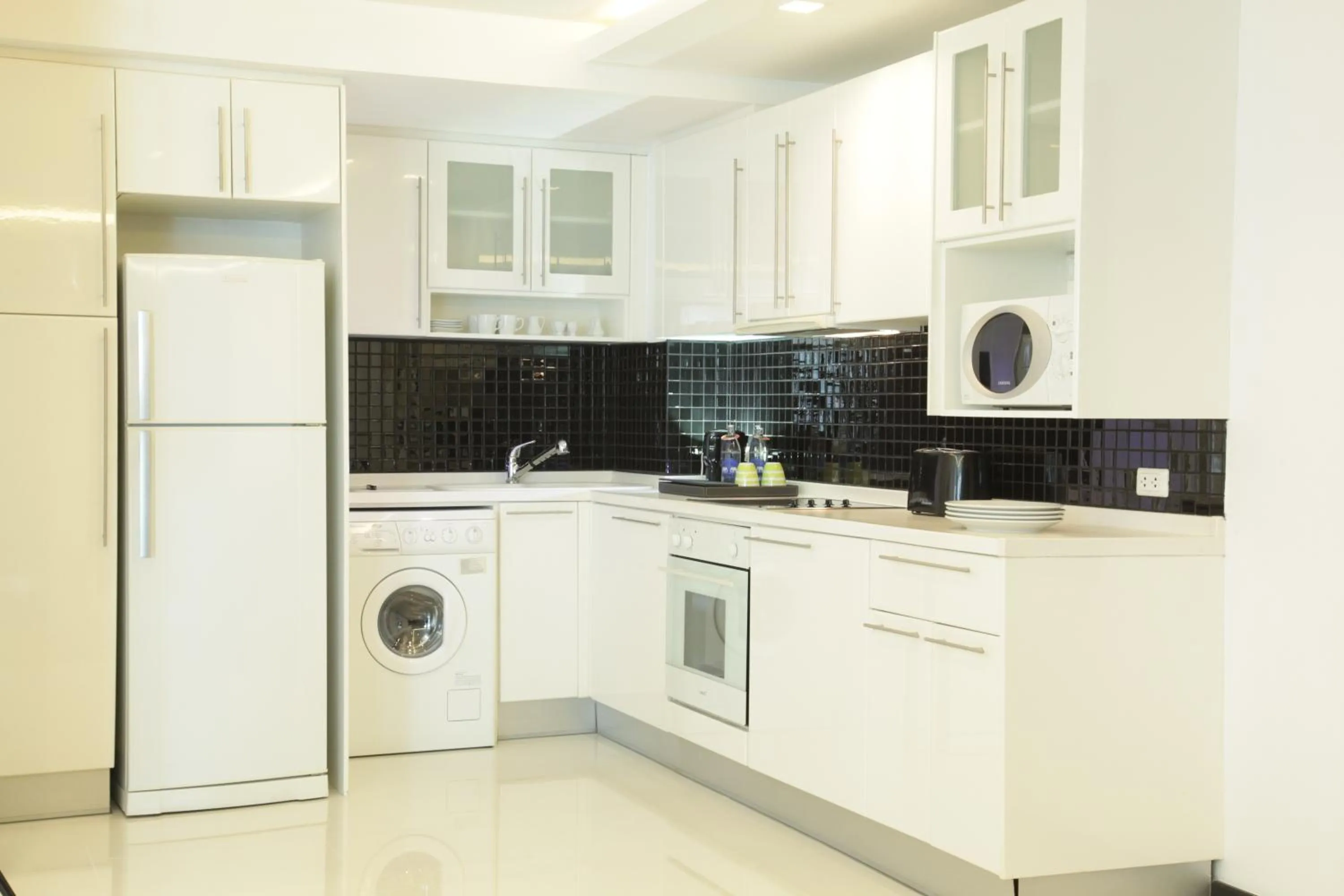 Kitchen or kitchenette in Nova Suites Pattaya by Compass Hospitality
