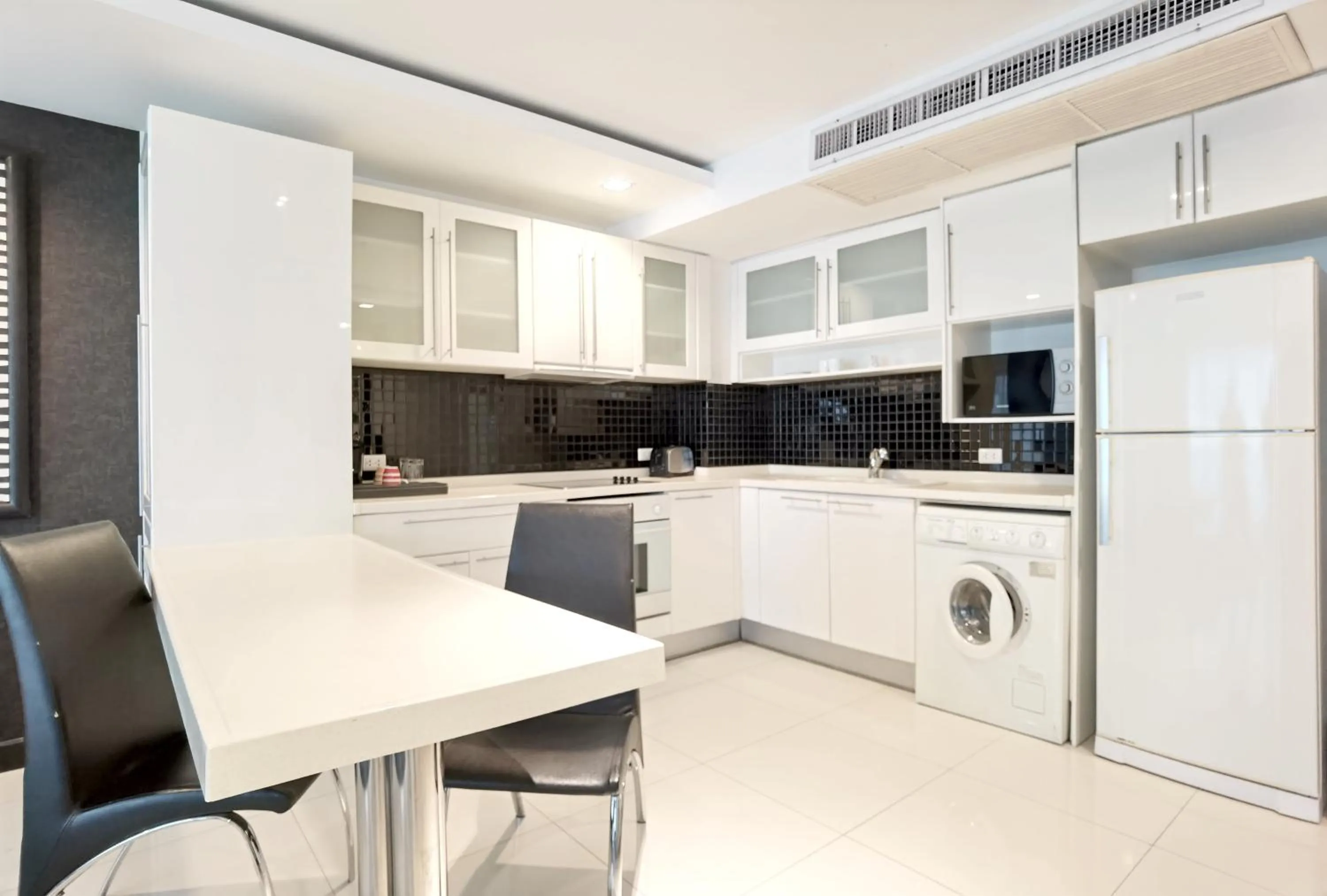 Kitchen or kitchenette in Nova Suites Pattaya by Compass Hospitality
