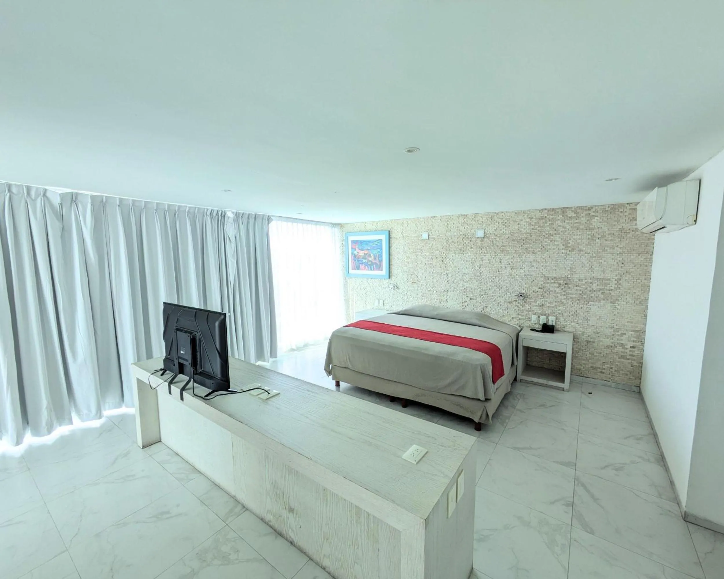 Photo of the whole room, Bed in We Hotel Acapulco