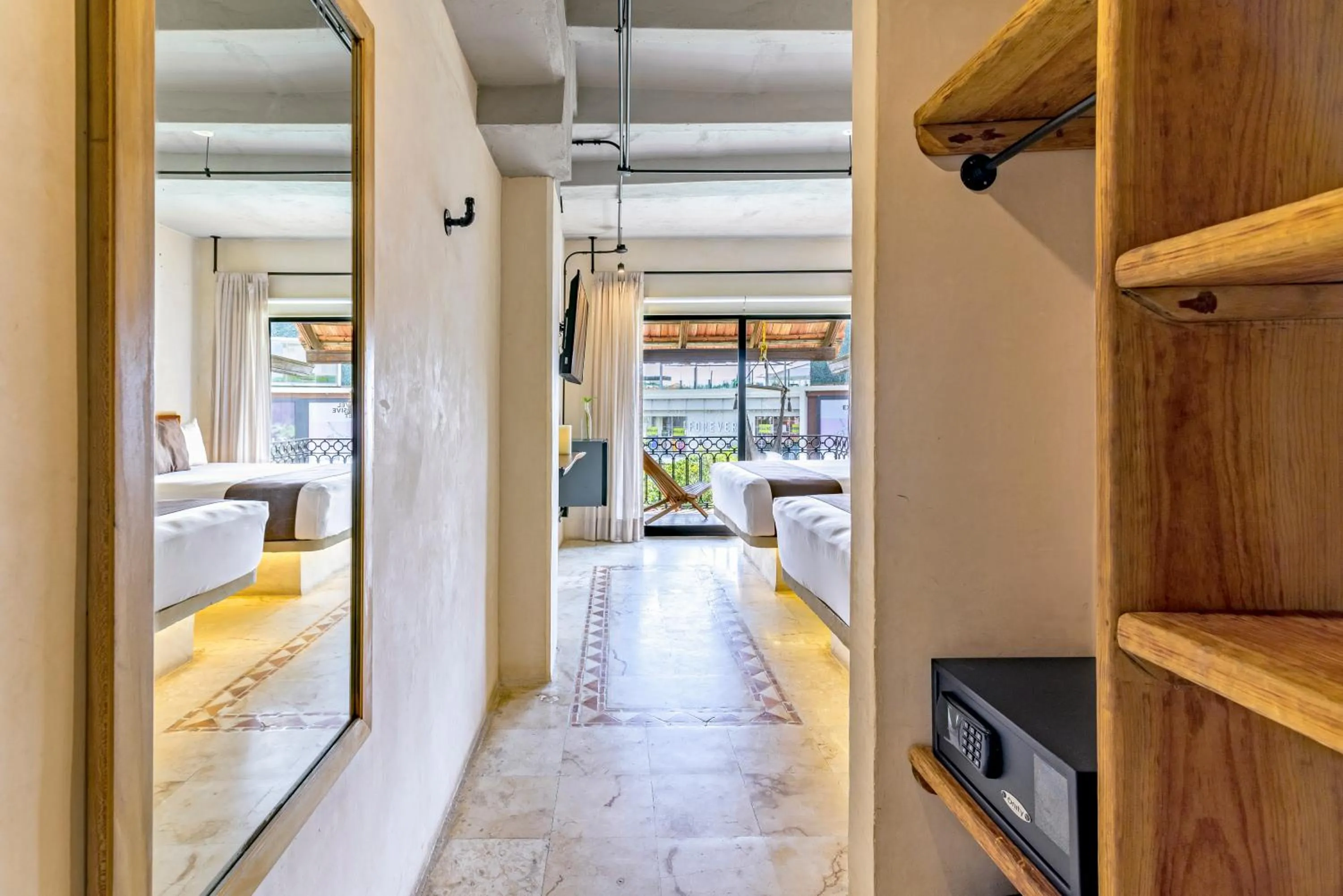 wardrobe, Bed in Caribbean Paradise Hotel & Spa - 5th Avenue