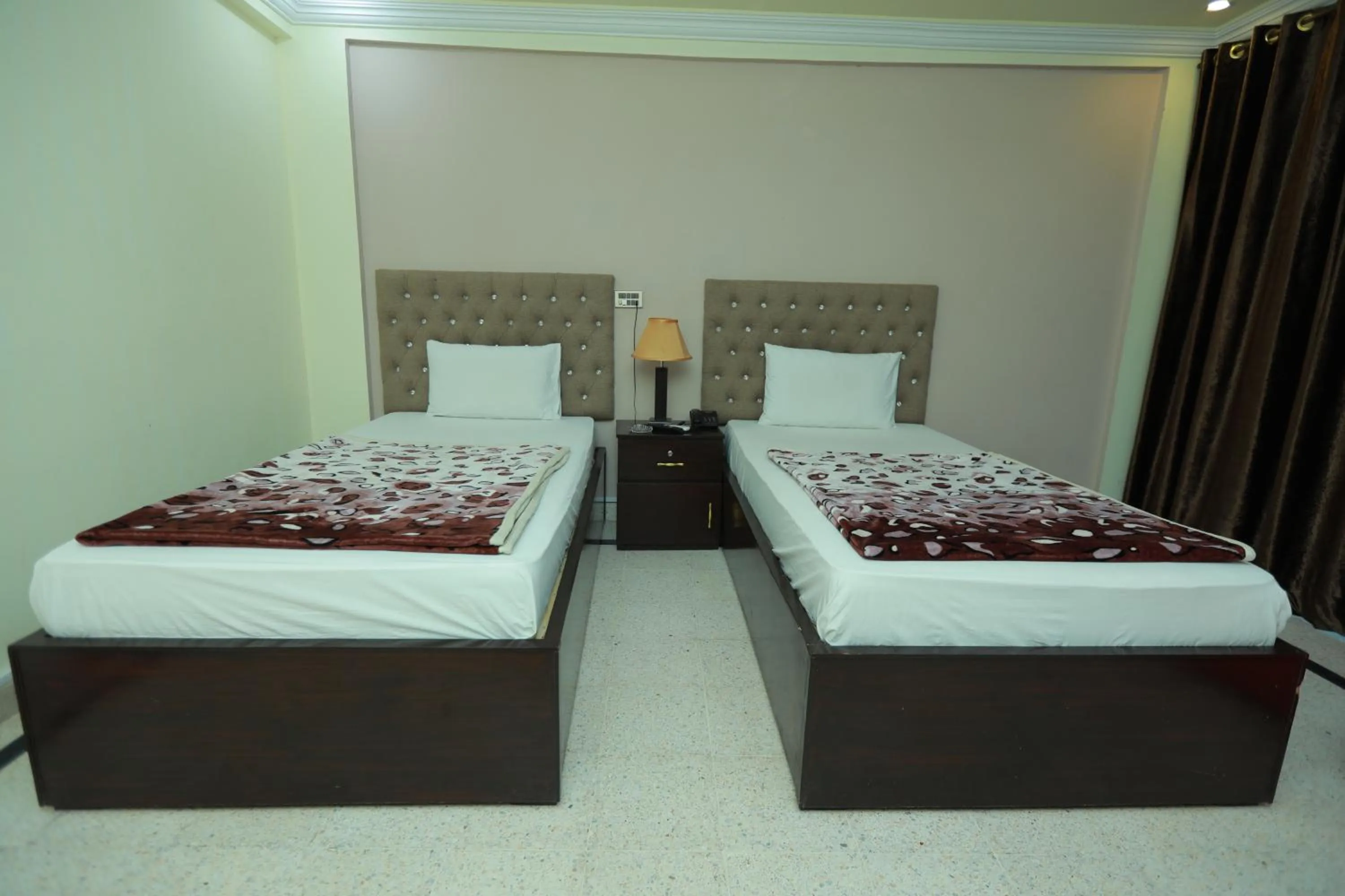 Bed in Muzaffarabad View Motel