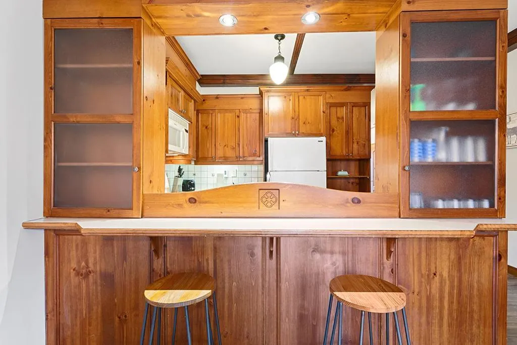 Kitchen or kitchenette in Le Manoir 106-7 by Escapades Tremblant