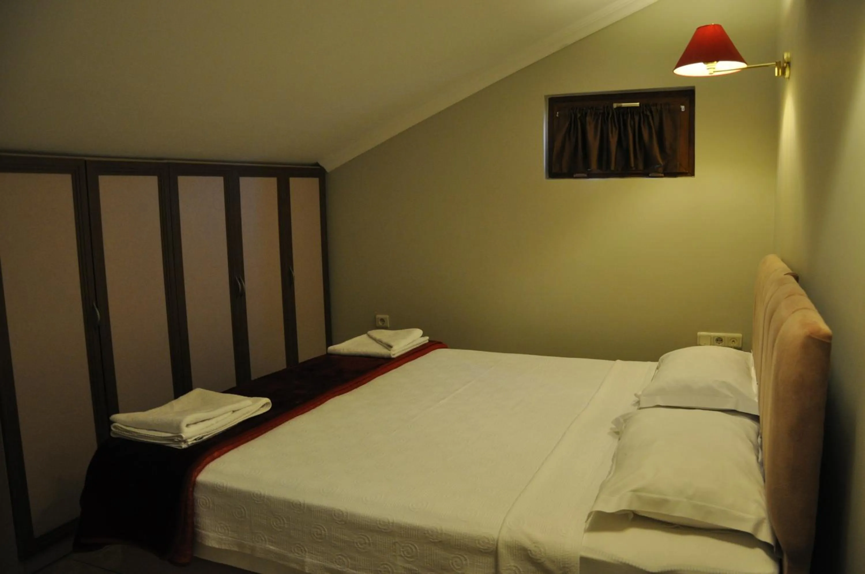 Bed in Mr. Dim Exclusive Apart Hotel