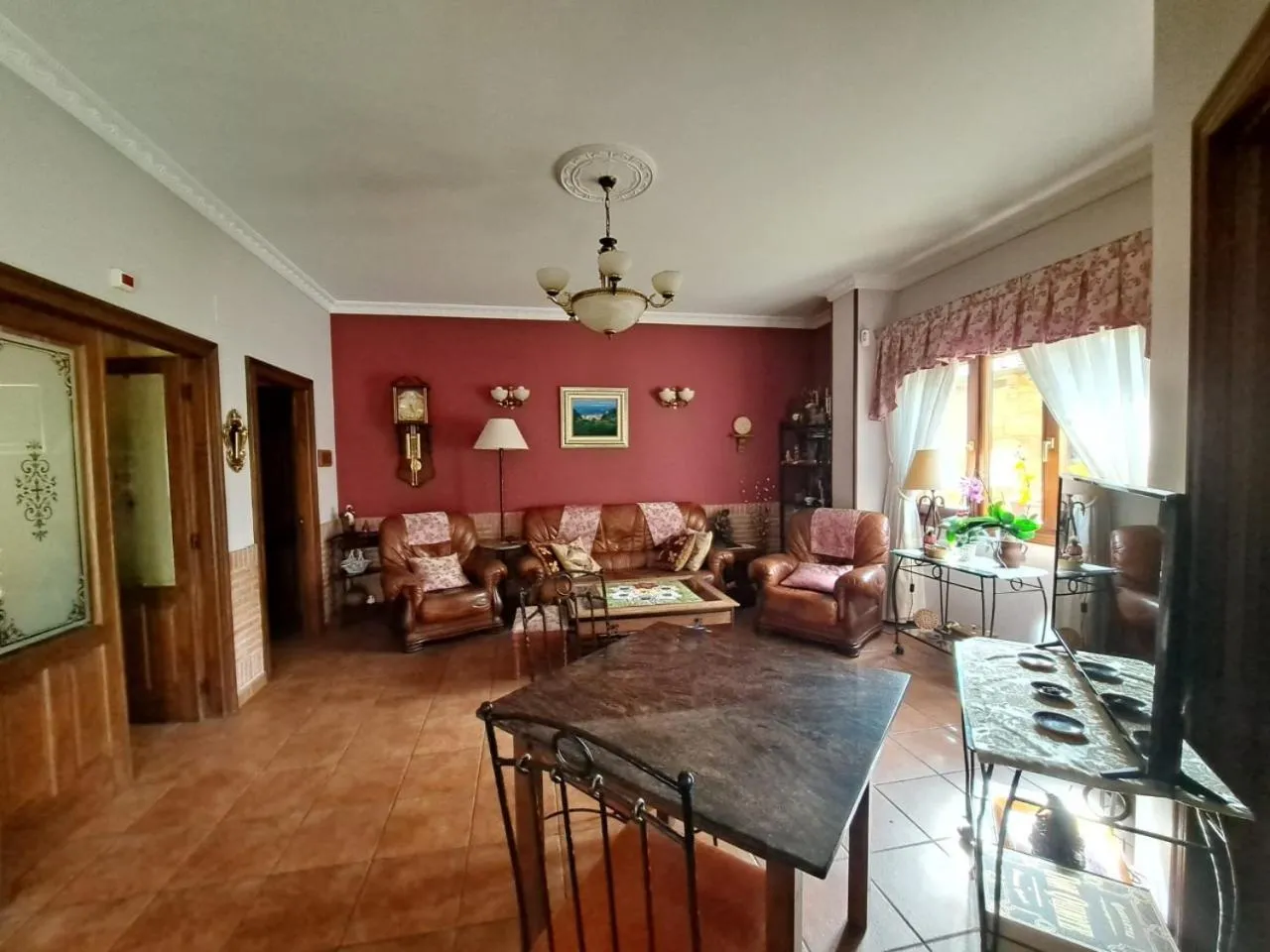 Communal lounge/ TV room in Posada Carpe Diem