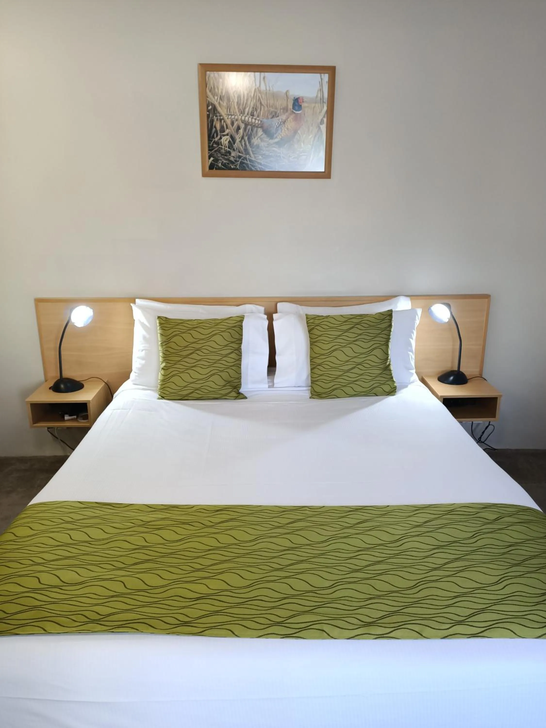 Bed in ASURE Macy's Motor Inn