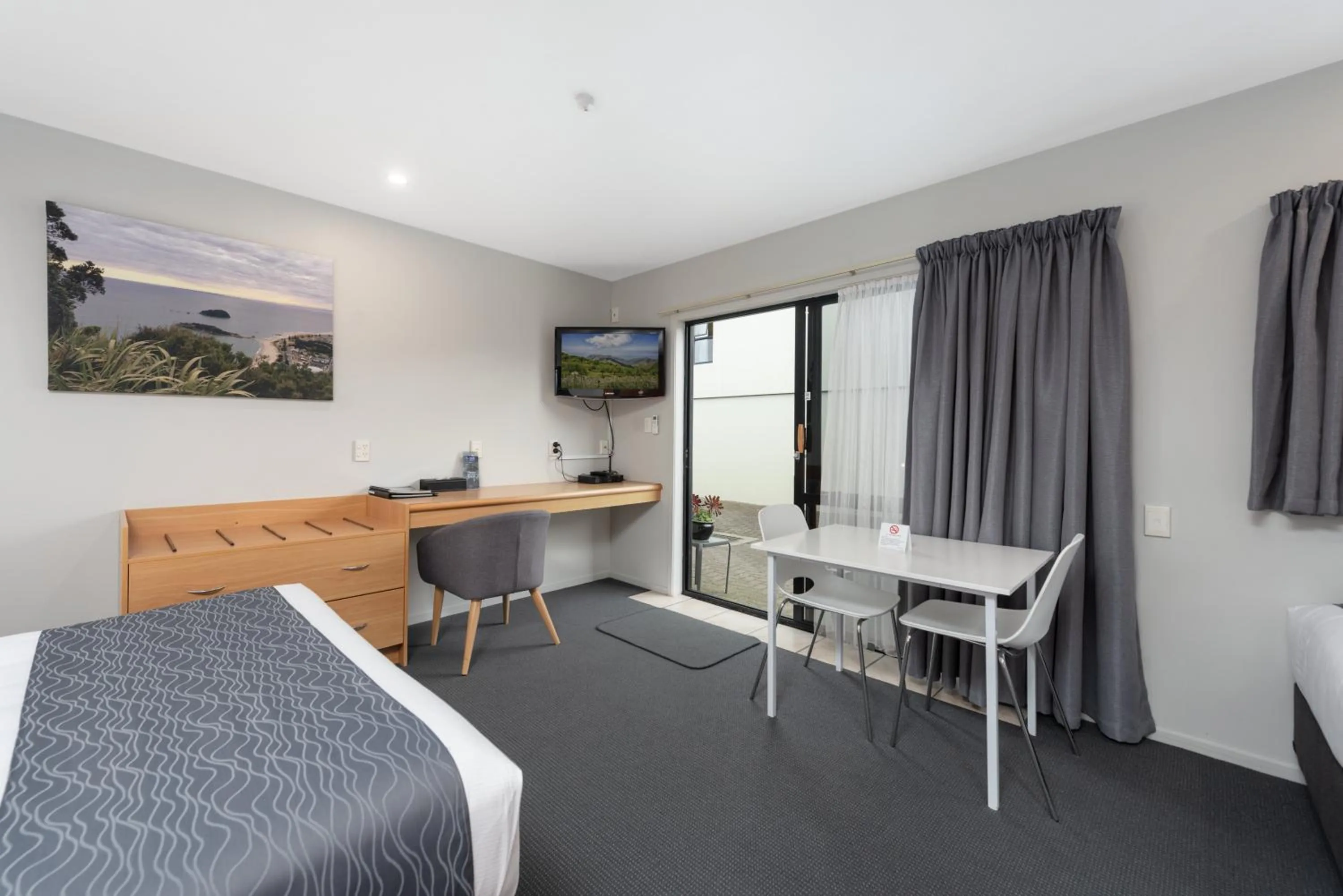 Bed in ASURE Macy's Motor Inn