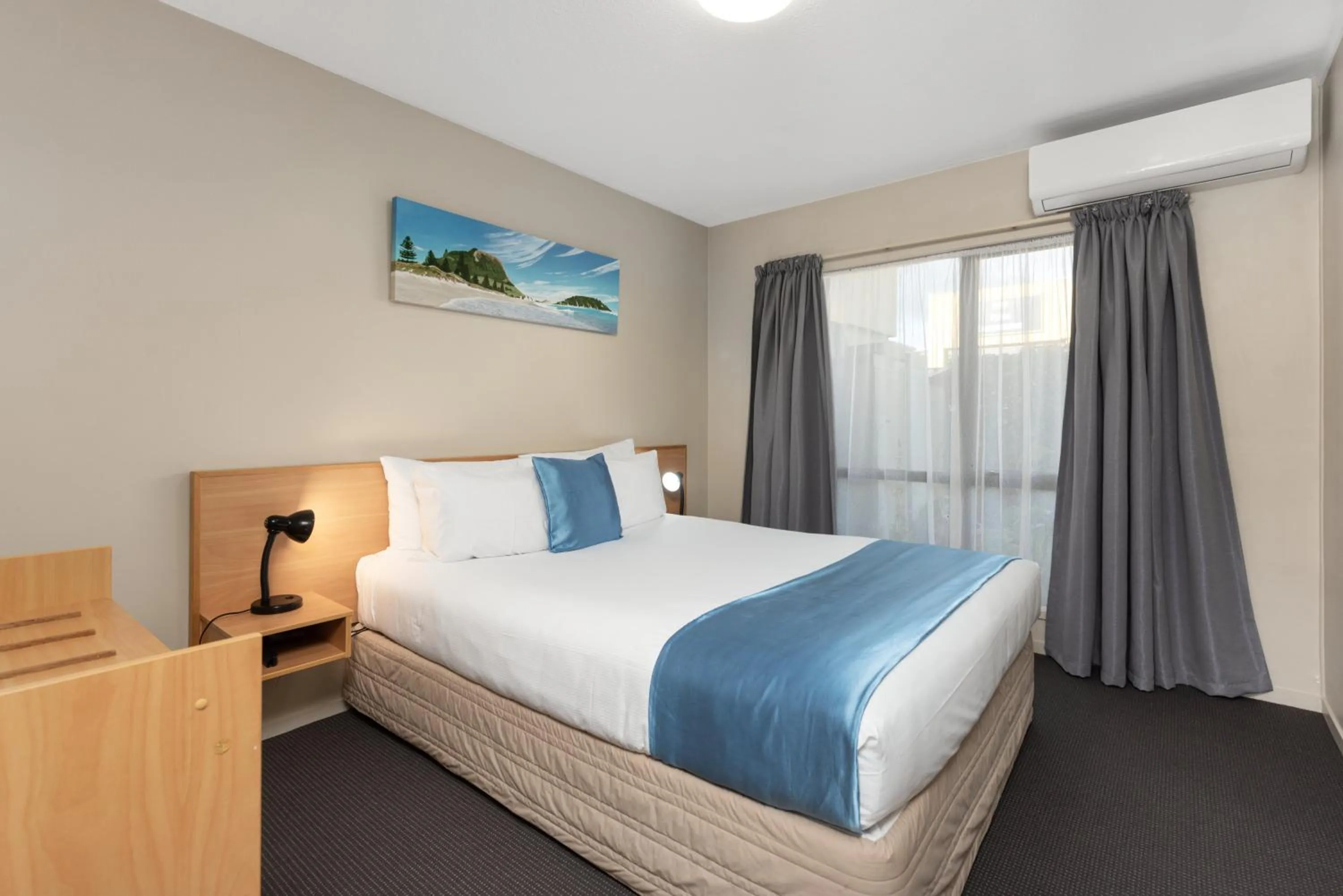 Bed in ASURE Macy's Motor Inn