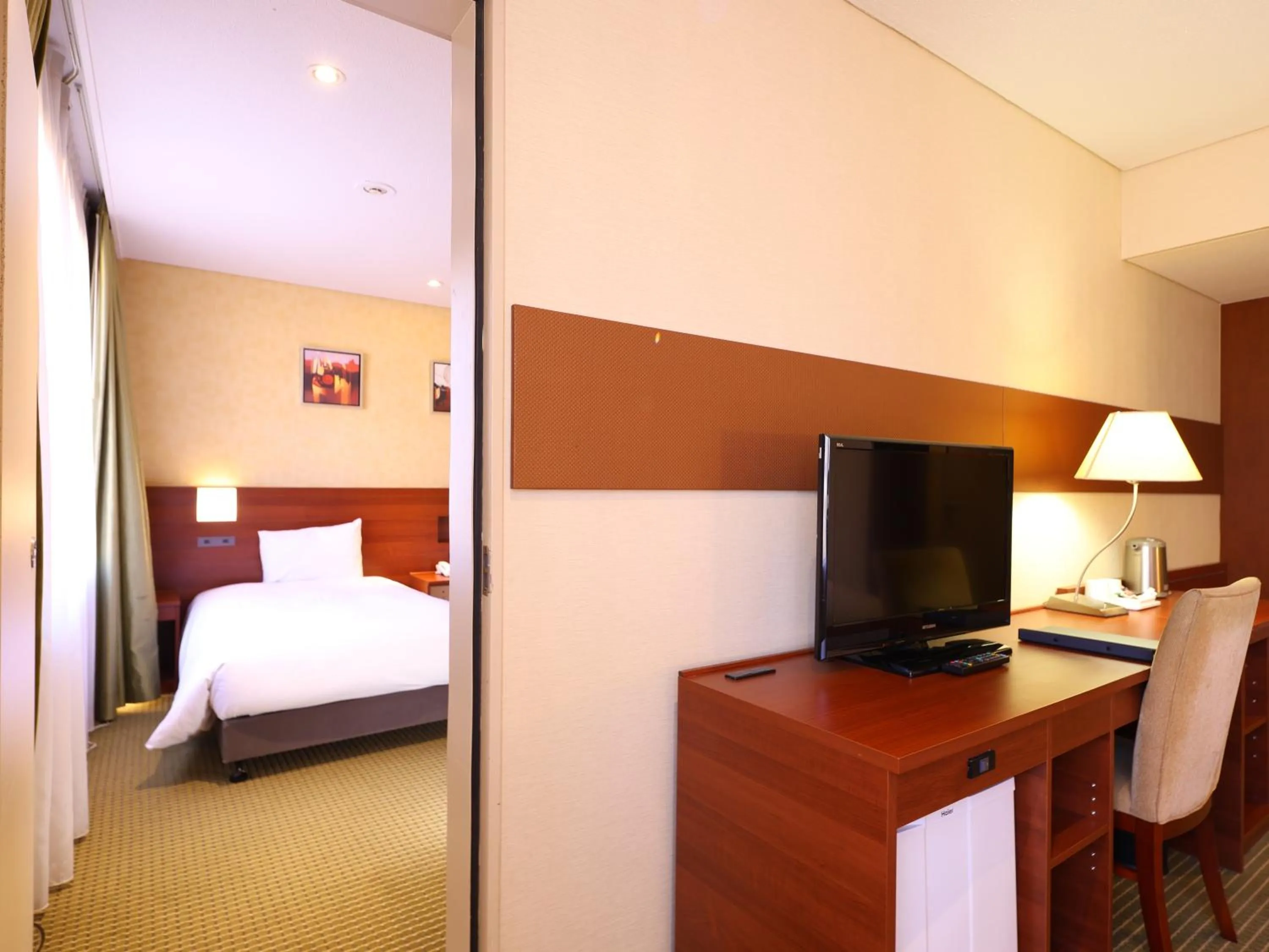 Bed in International Resort Hotel Yurakujo