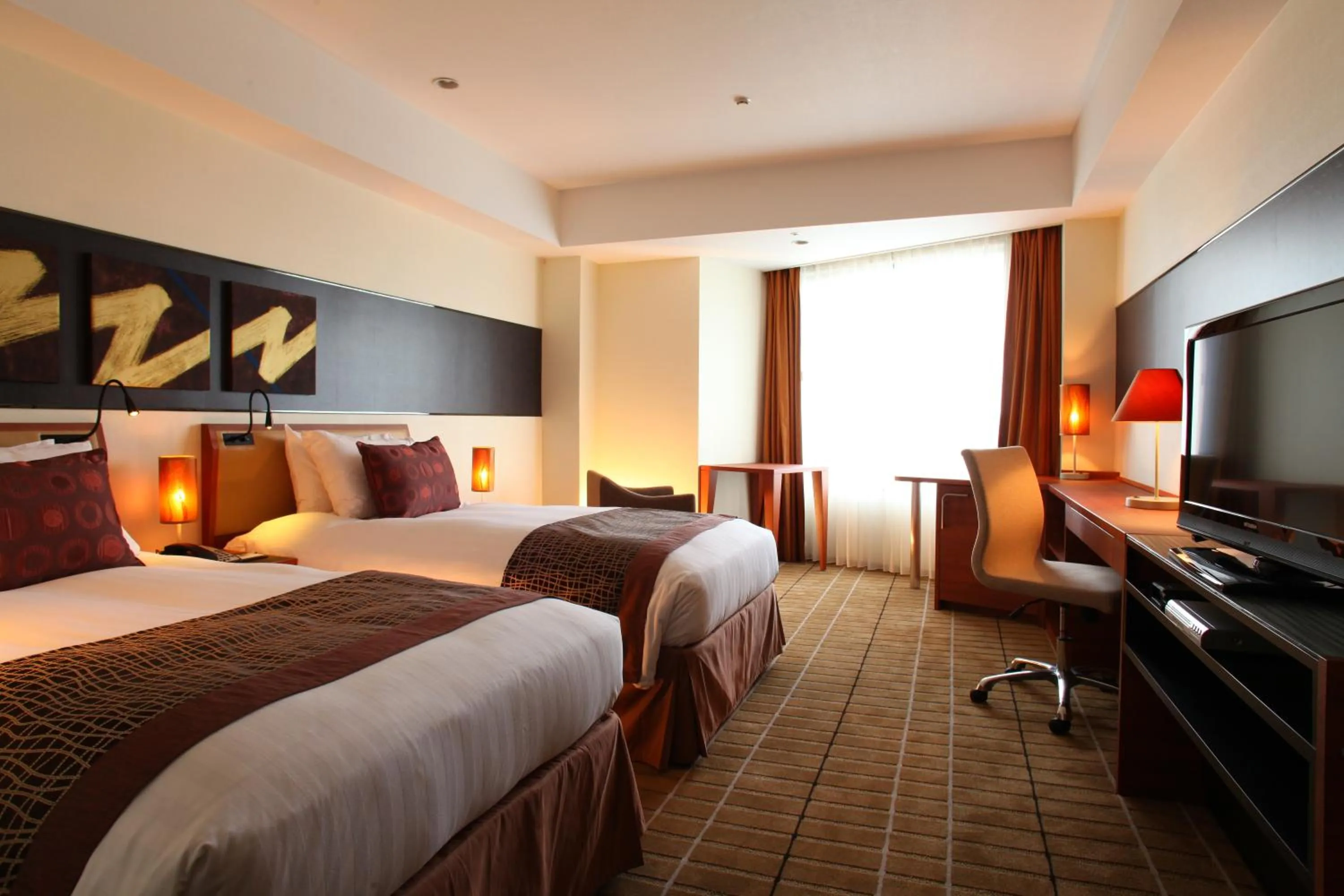 Bed in International Resort Hotel Yurakujo