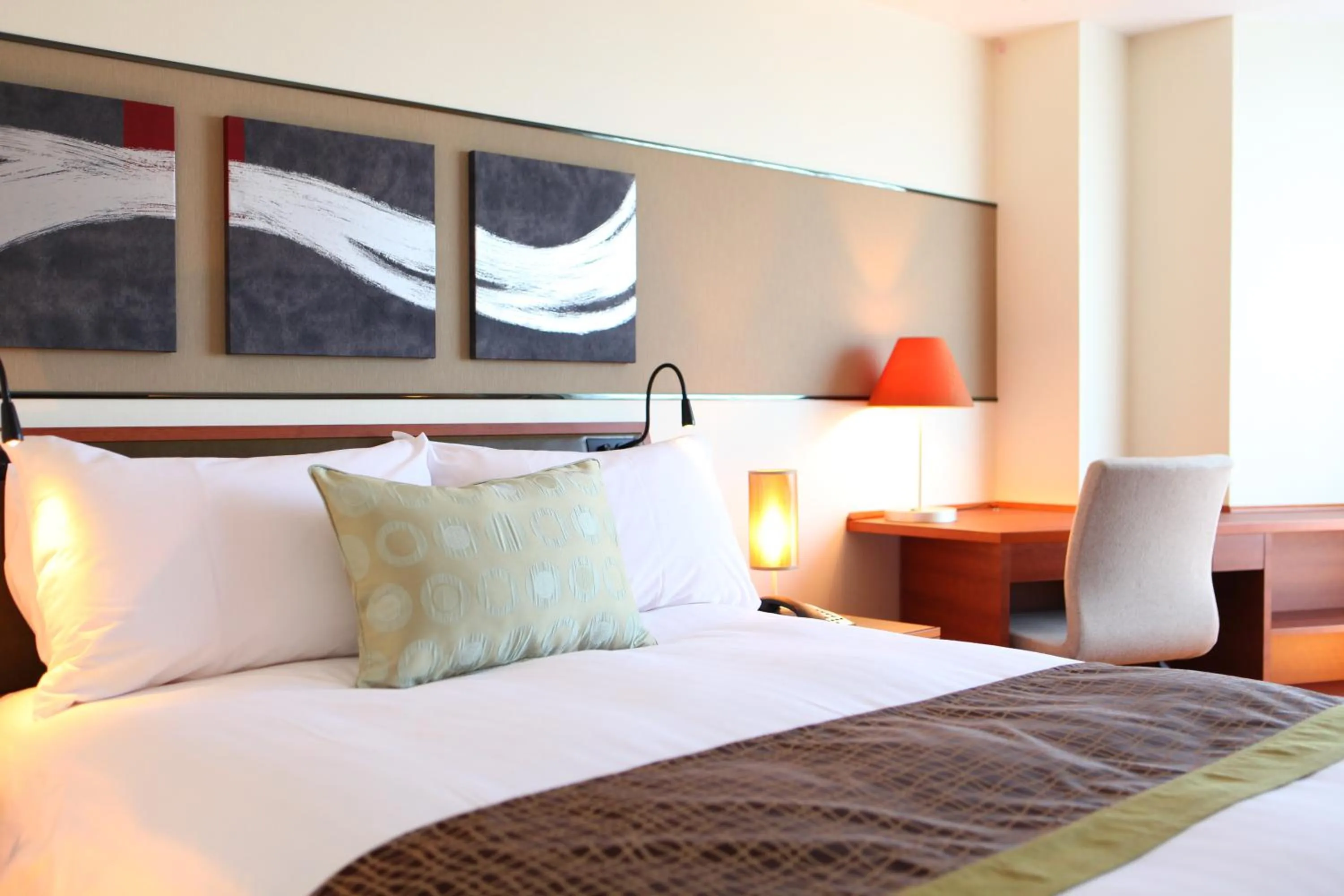 Bed in International Resort Hotel Yurakujo