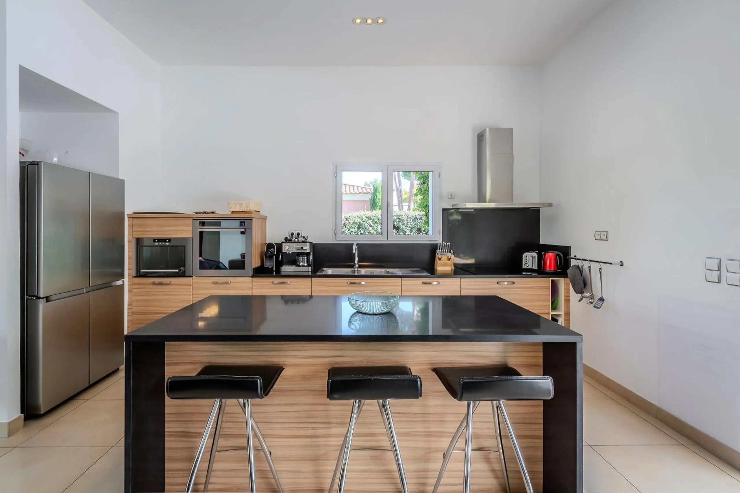 Kitchen or kitchenette in Domaine Villas Mandarine Private Pools & Spa