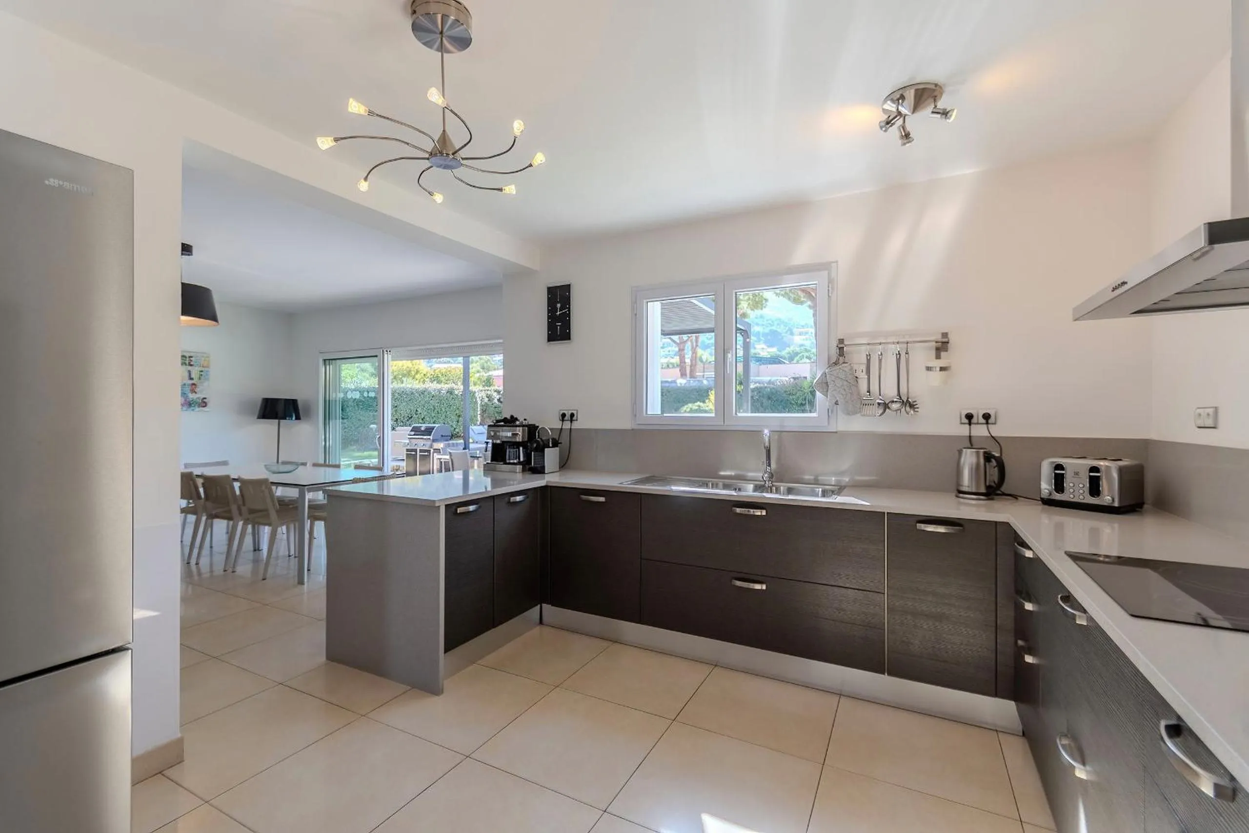 Kitchen or kitchenette in Domaine Villas Mandarine Private Pools & Spa