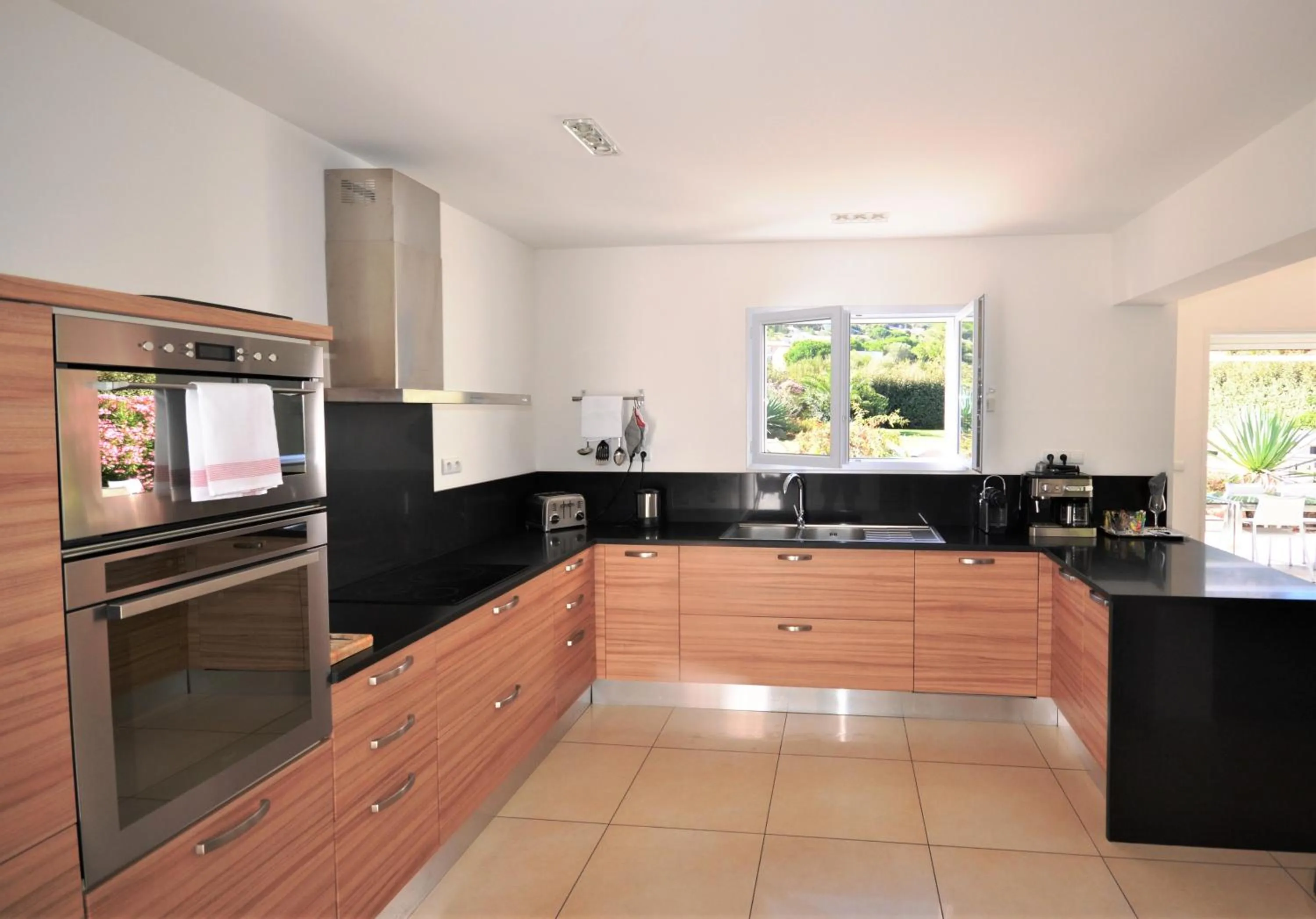 Kitchen or kitchenette in Domaine Villas Mandarine Private Pools & Spa