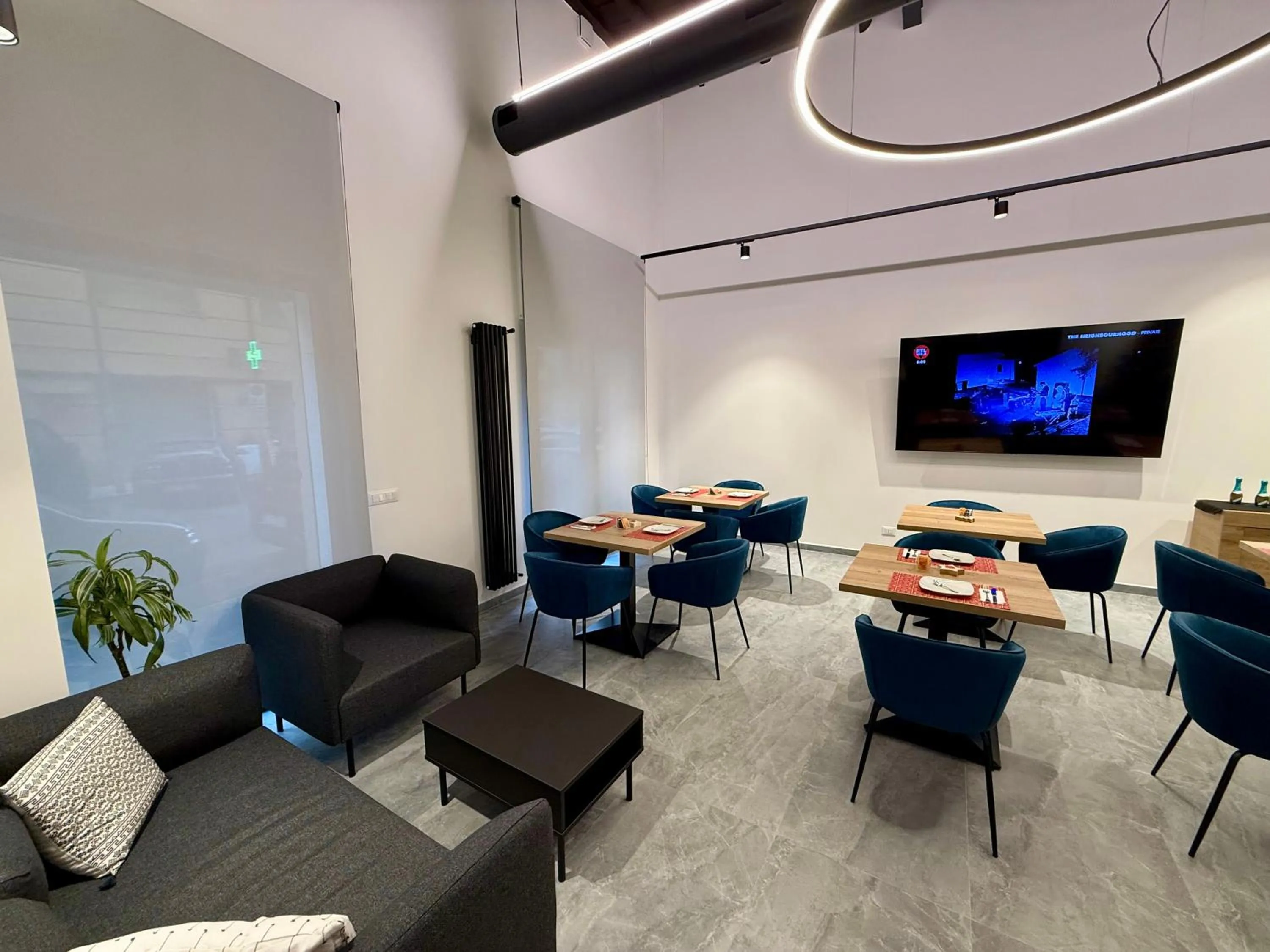 Communal lounge/ TV room in Le Quattro Stagioni - Rooms & Suites