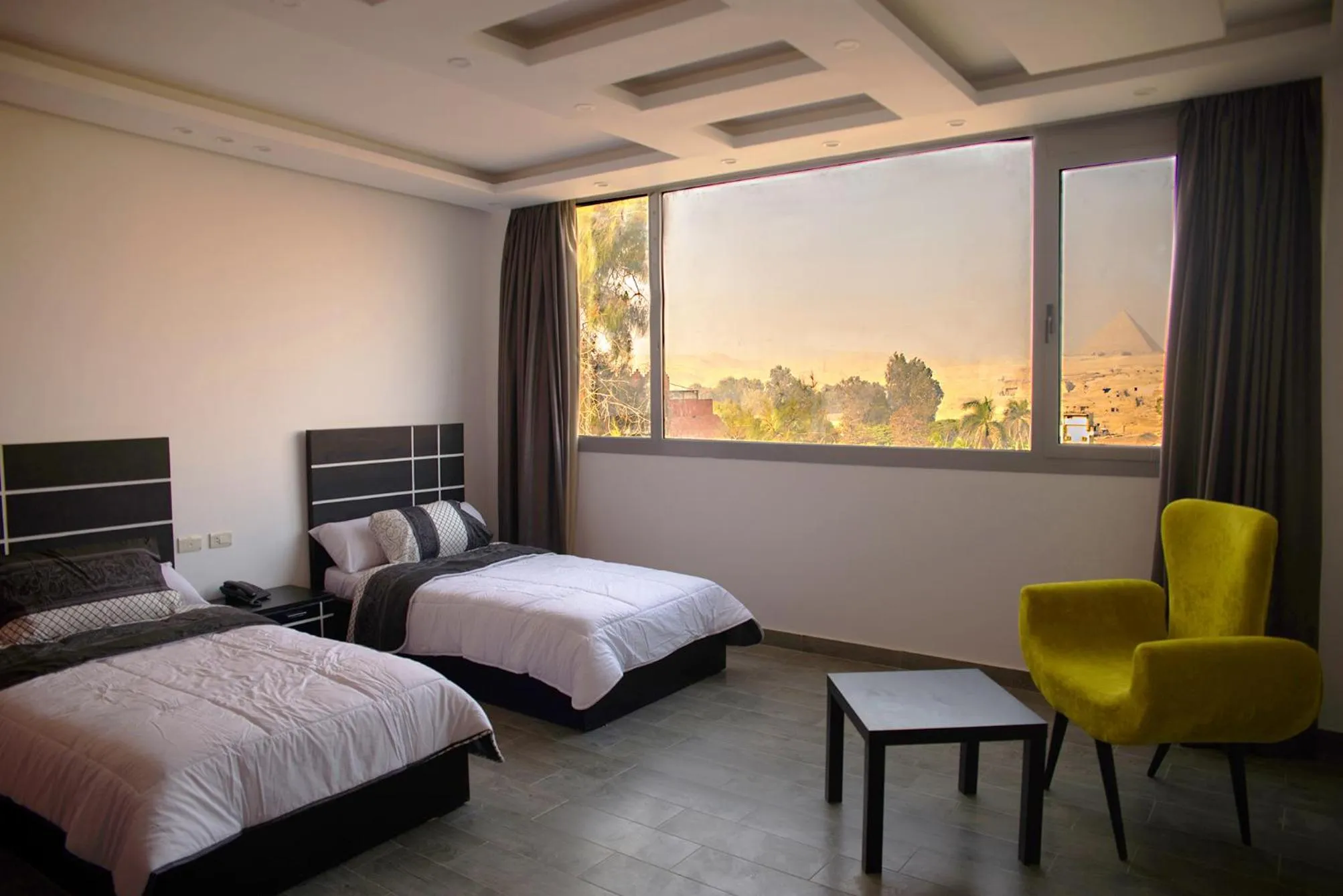 Seating area, Bed in Marvel Stone Hotel