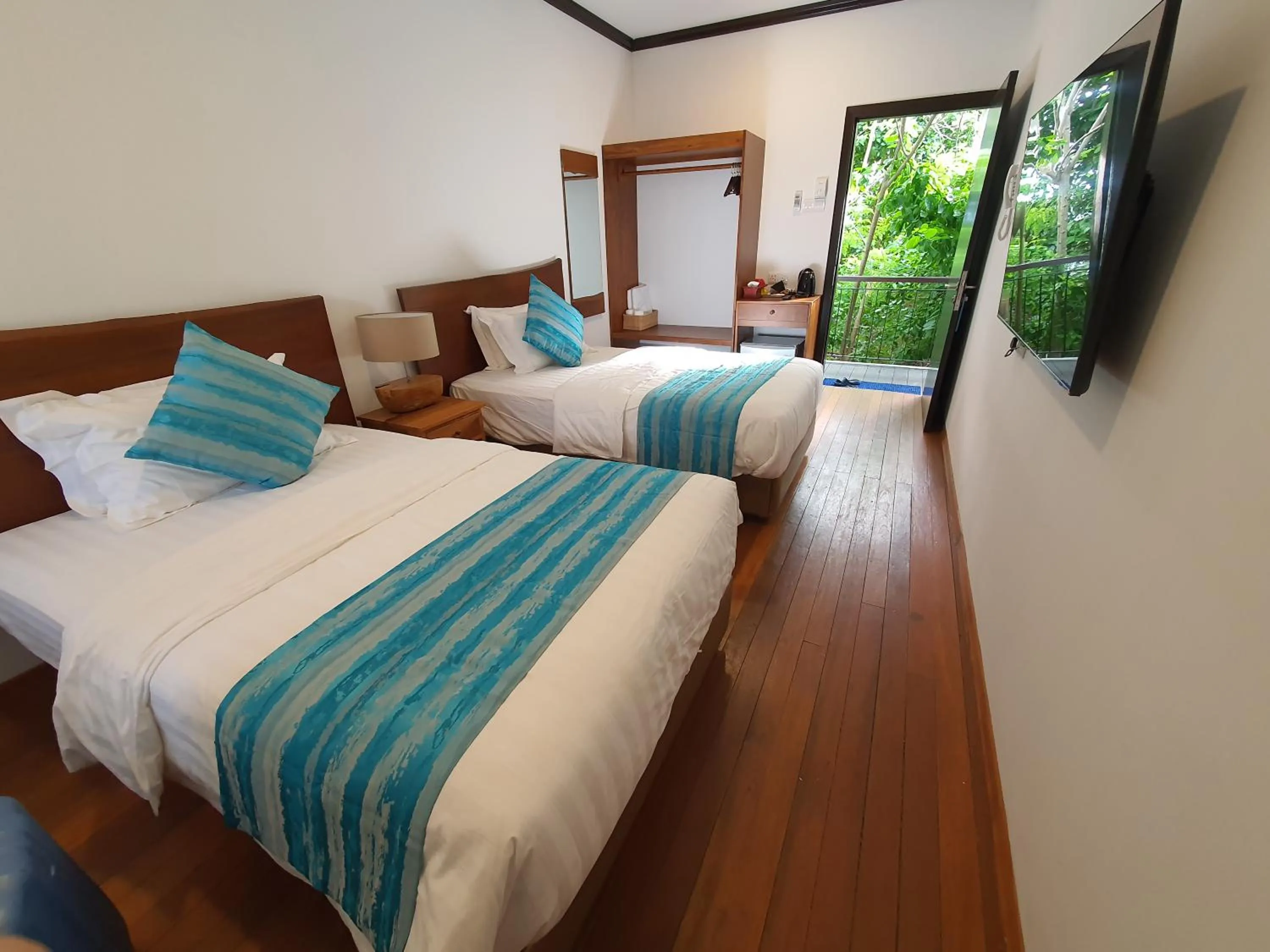 Bed in Borneo Divers Mabul Resort