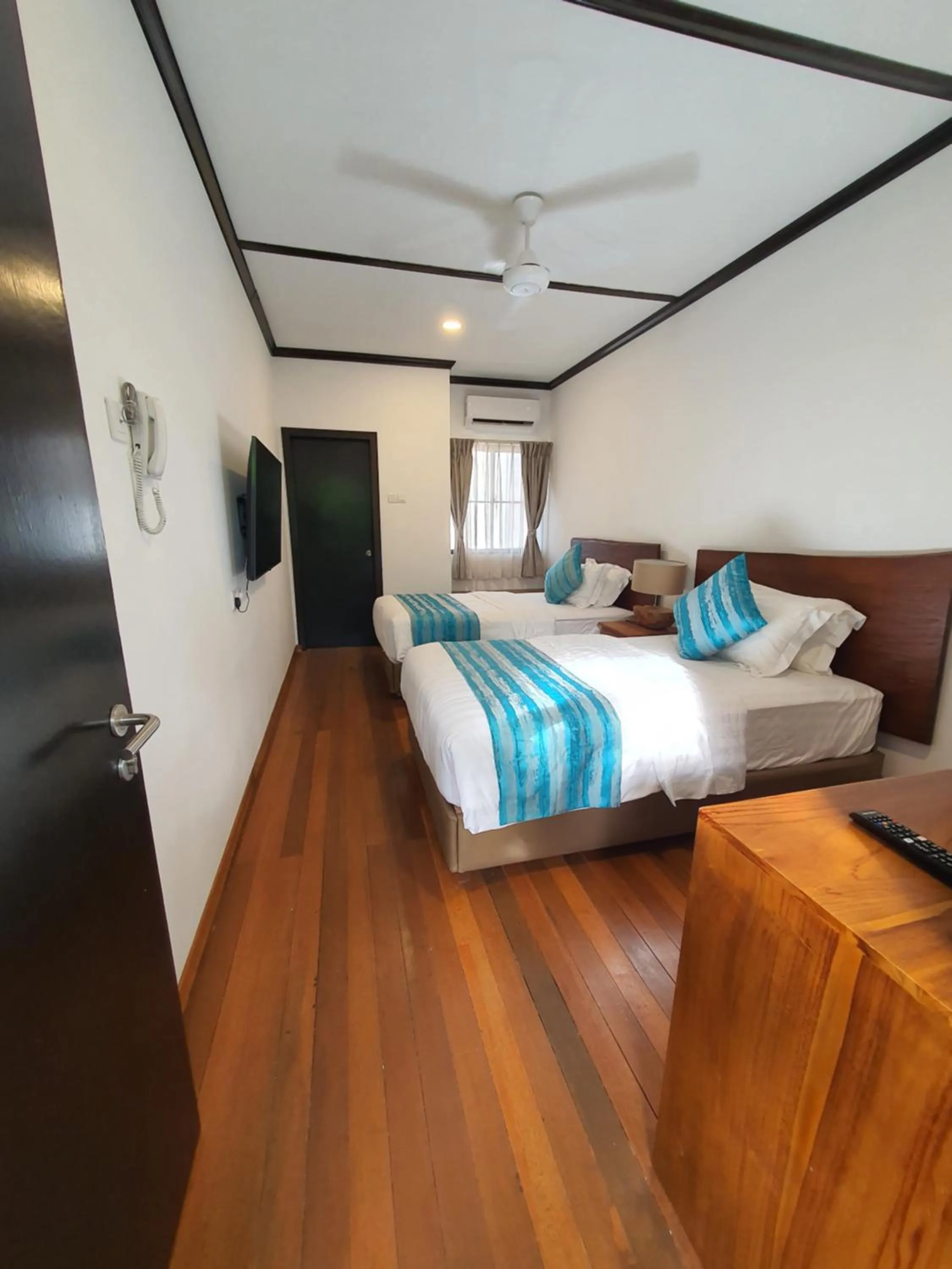 Bed in Borneo Divers Mabul Resort