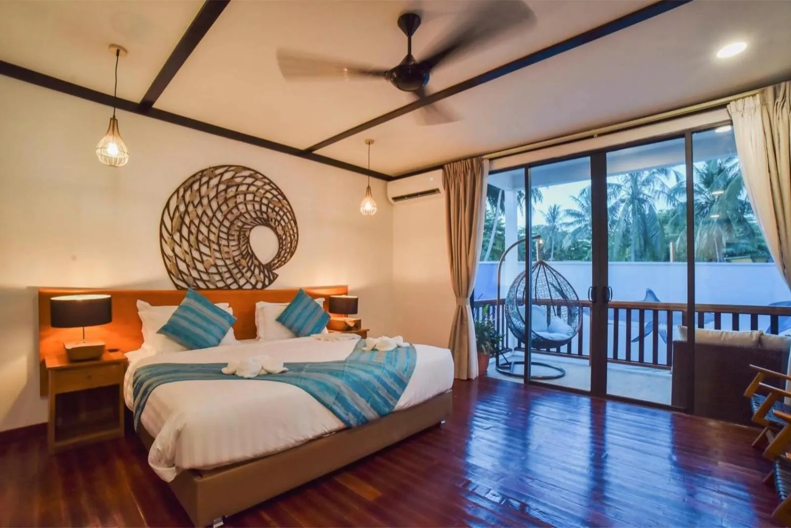 Bed in Borneo Divers Mabul Resort