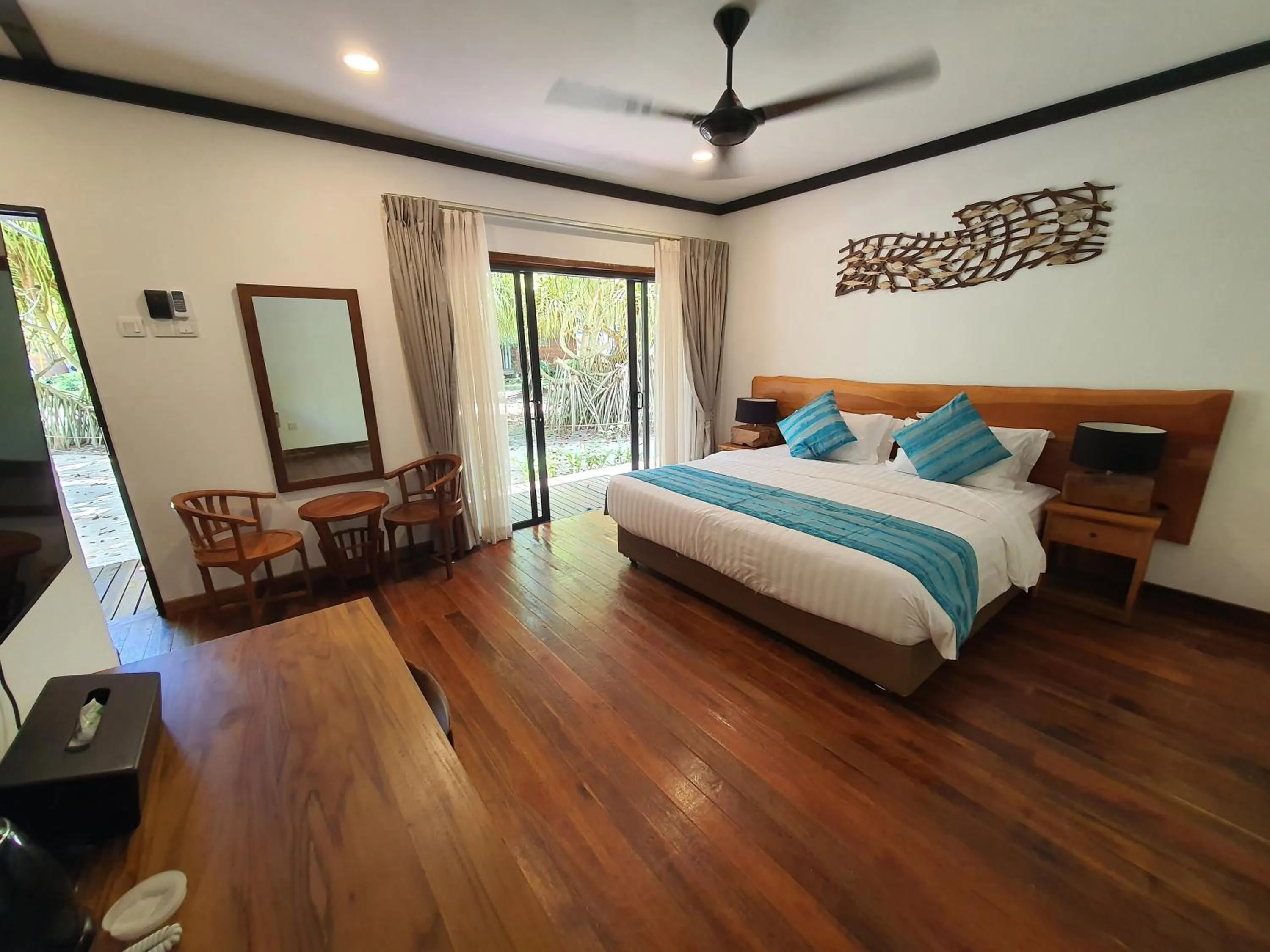 Bed in Borneo Divers Mabul Resort