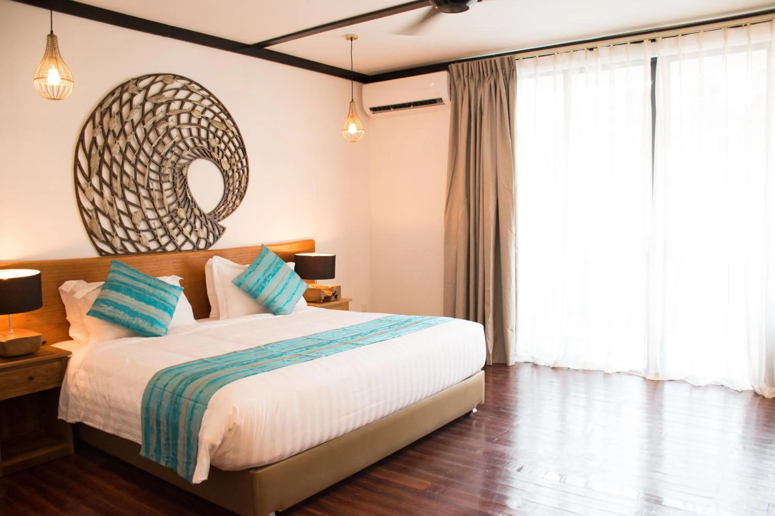 Bed in Borneo Divers Mabul Resort