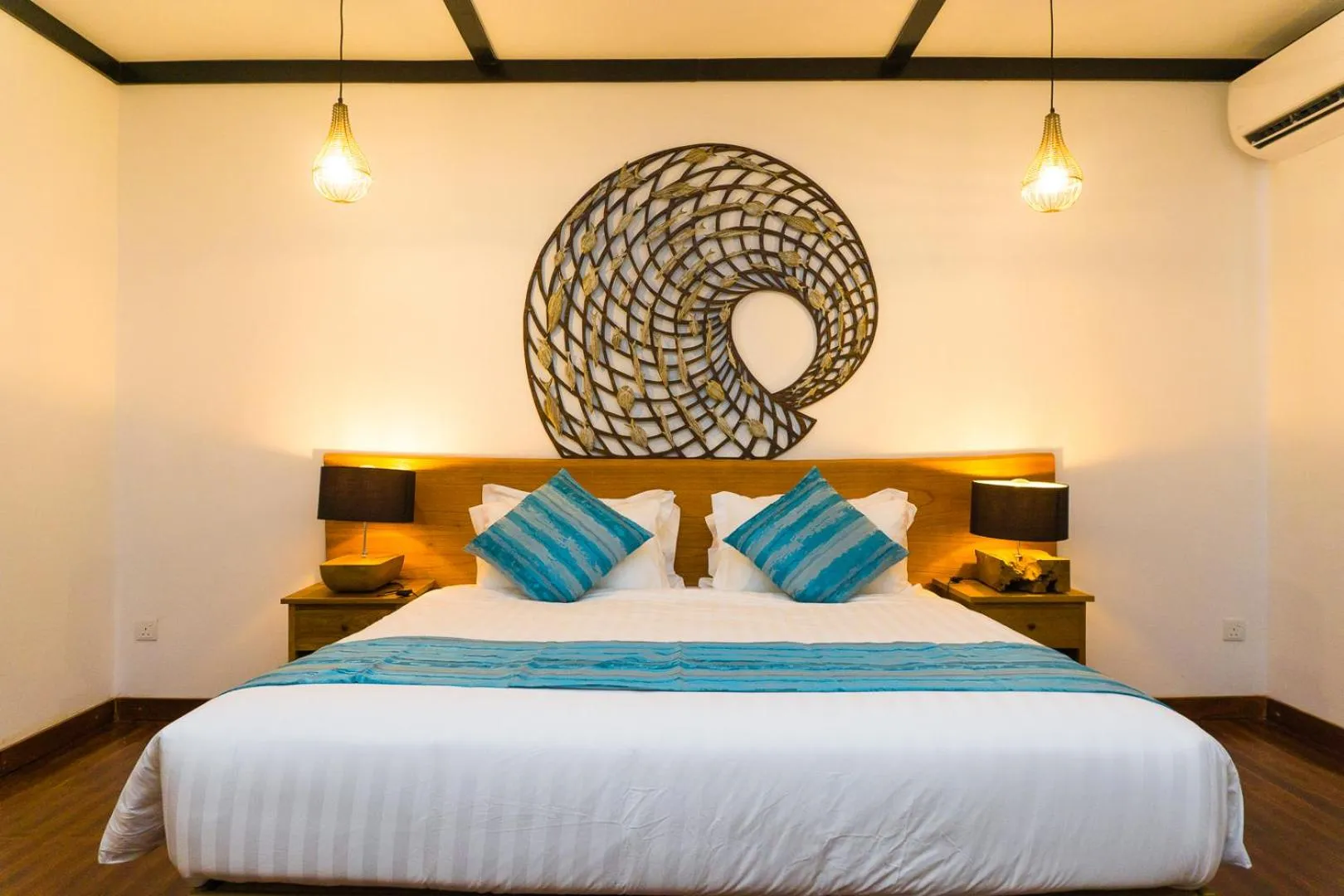 Bed in Borneo Divers Mabul Resort