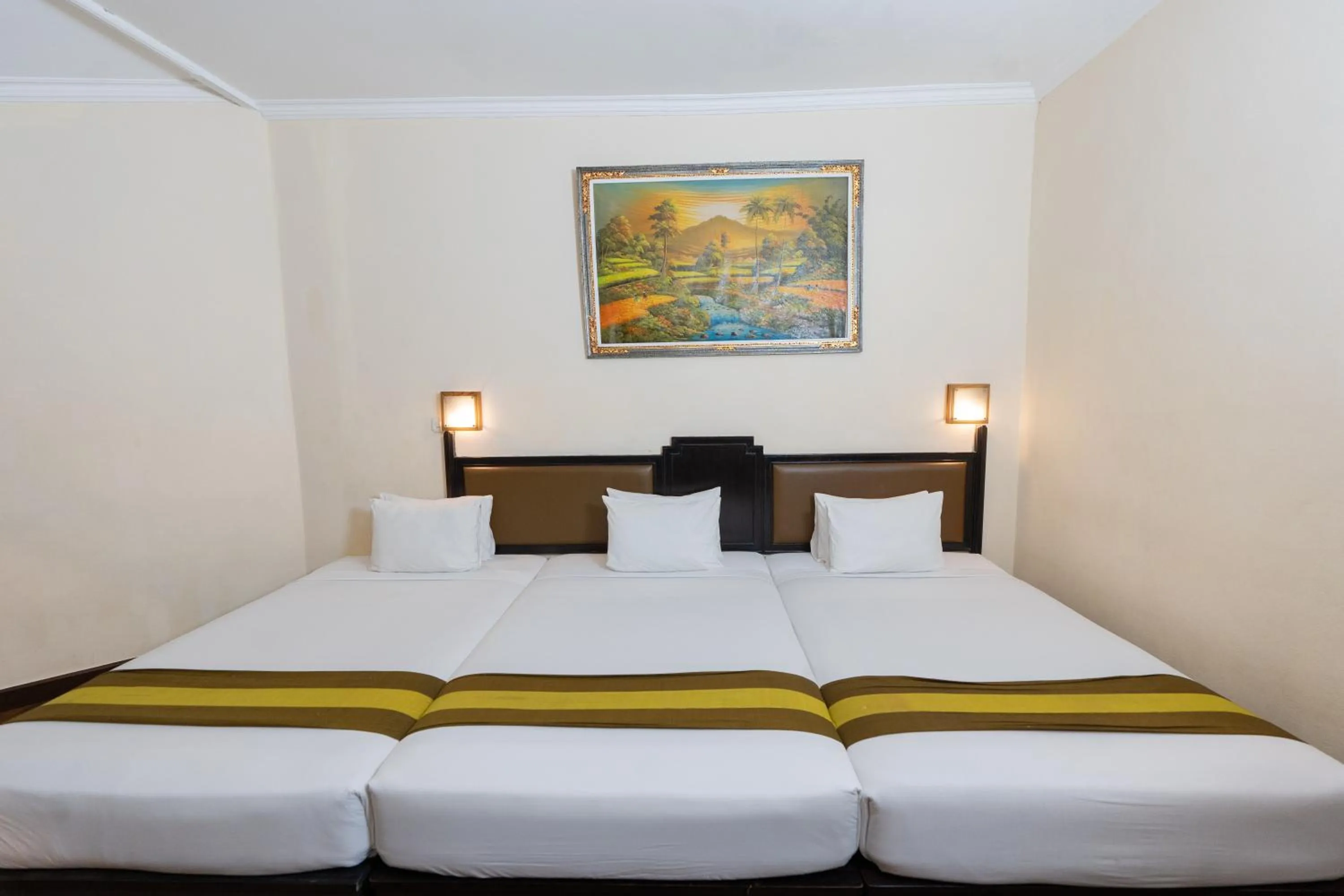 Bed in The Flora Kuta Bali