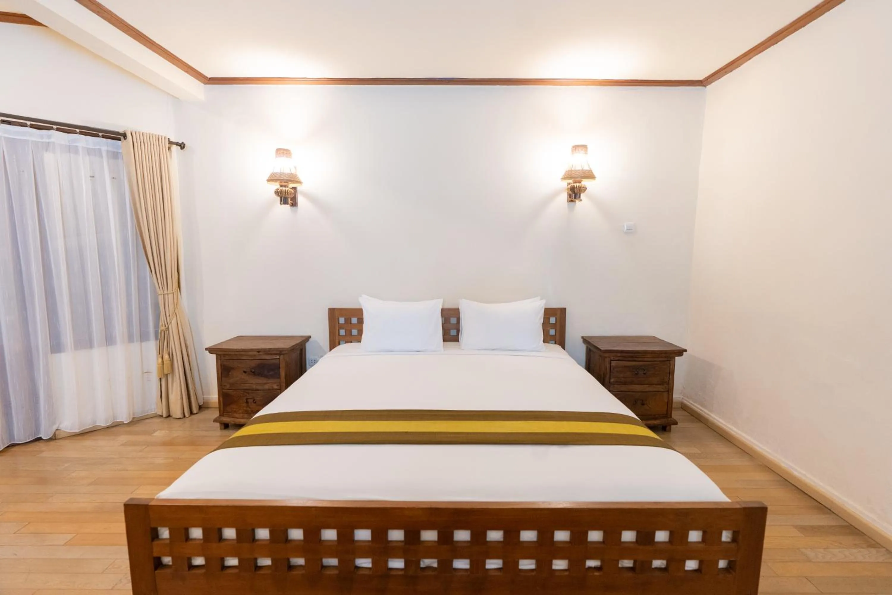 Bed in The Flora Kuta Bali