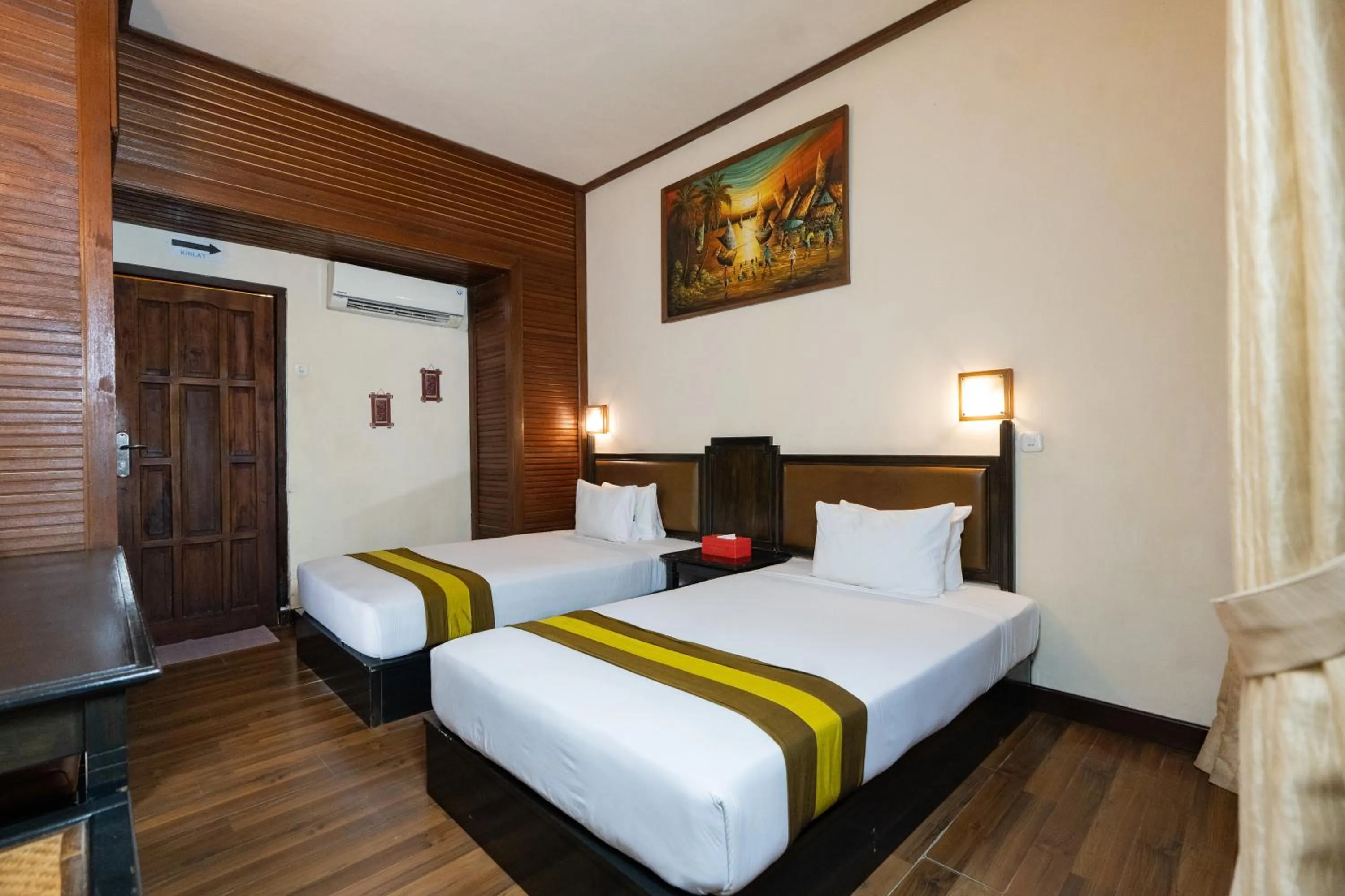 Bed in The Flora Kuta Bali