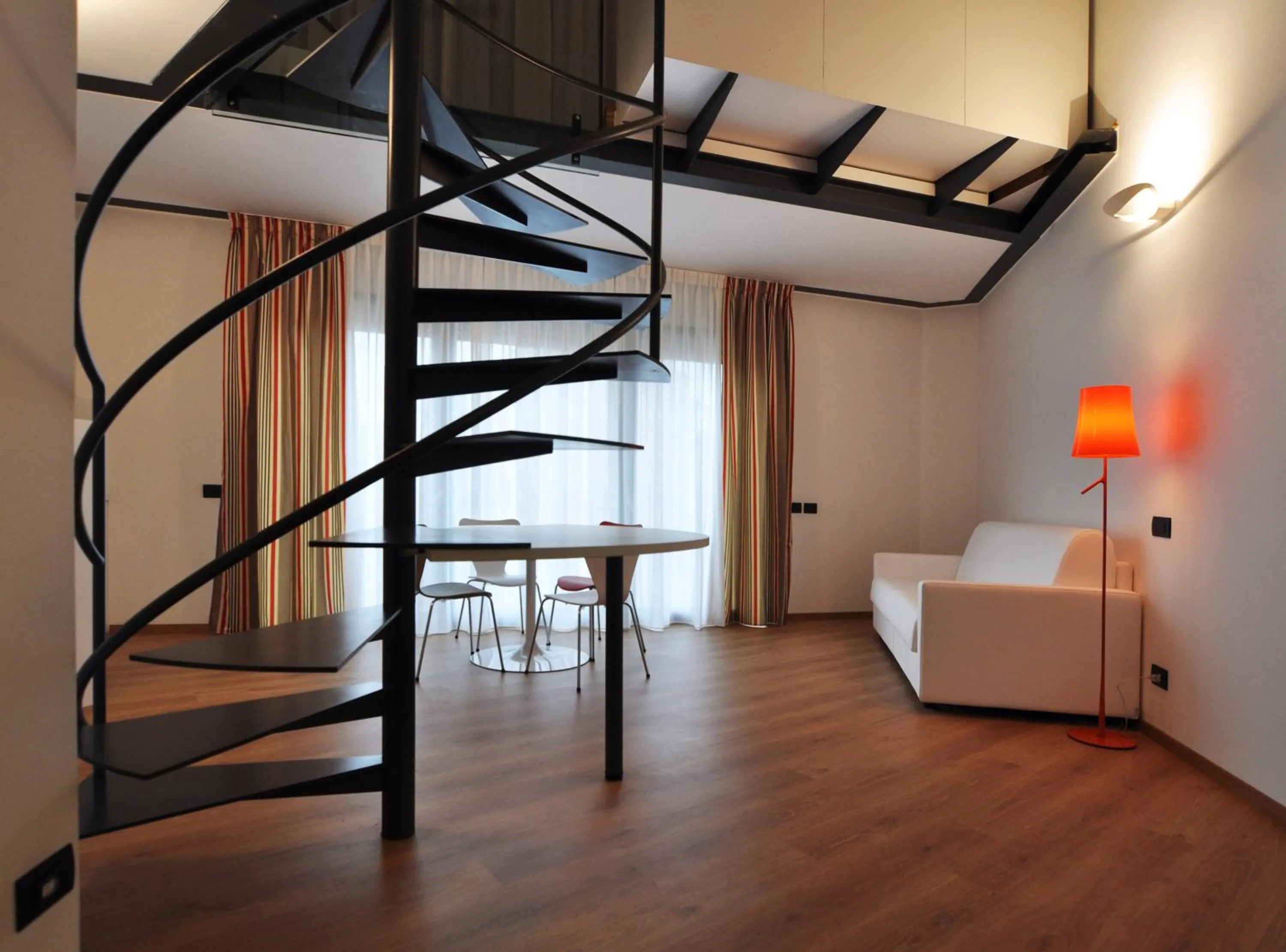 Living room, Bed in BB Hotels Aparthotel Isola