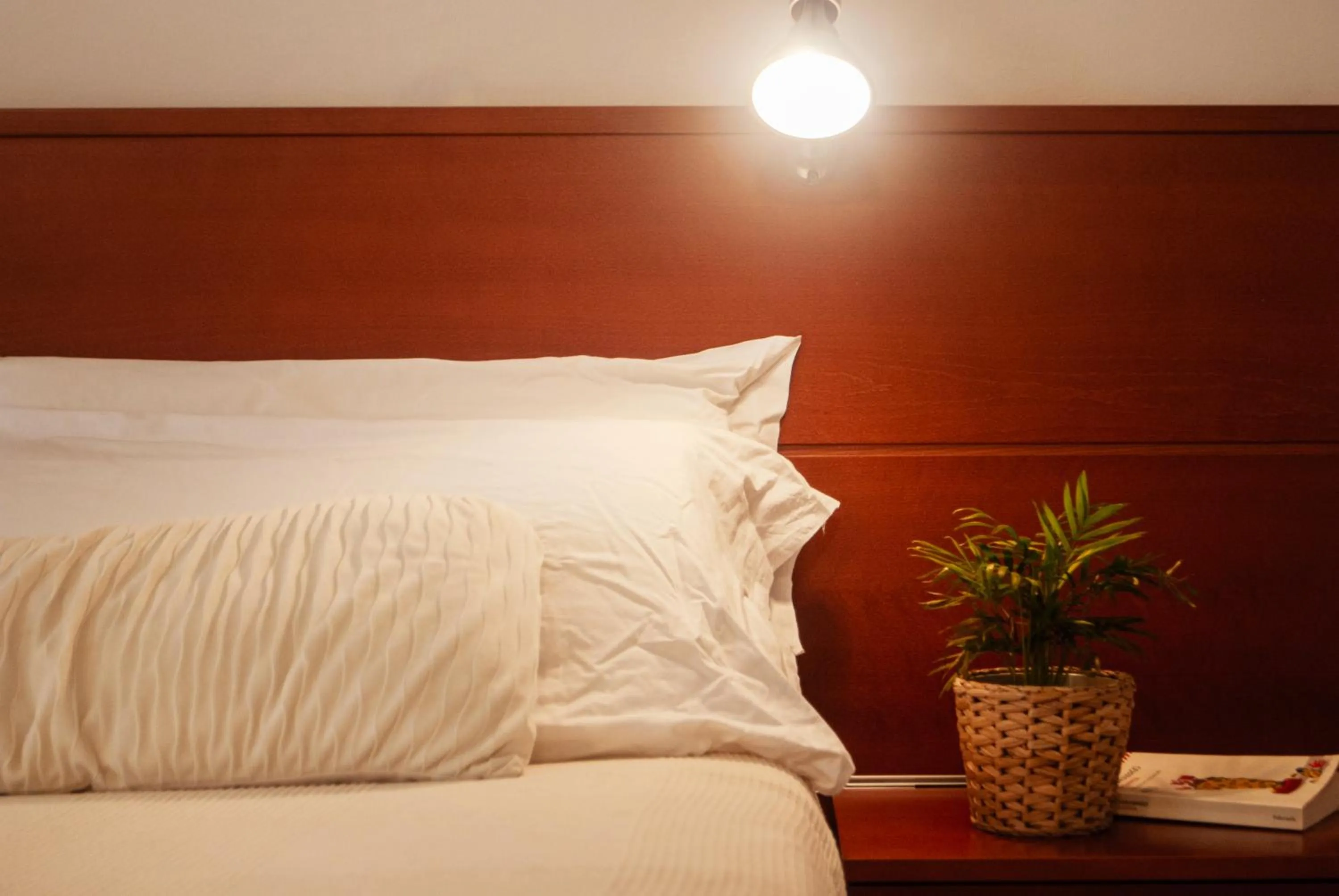 Bed in Marbela Apartments & Suites