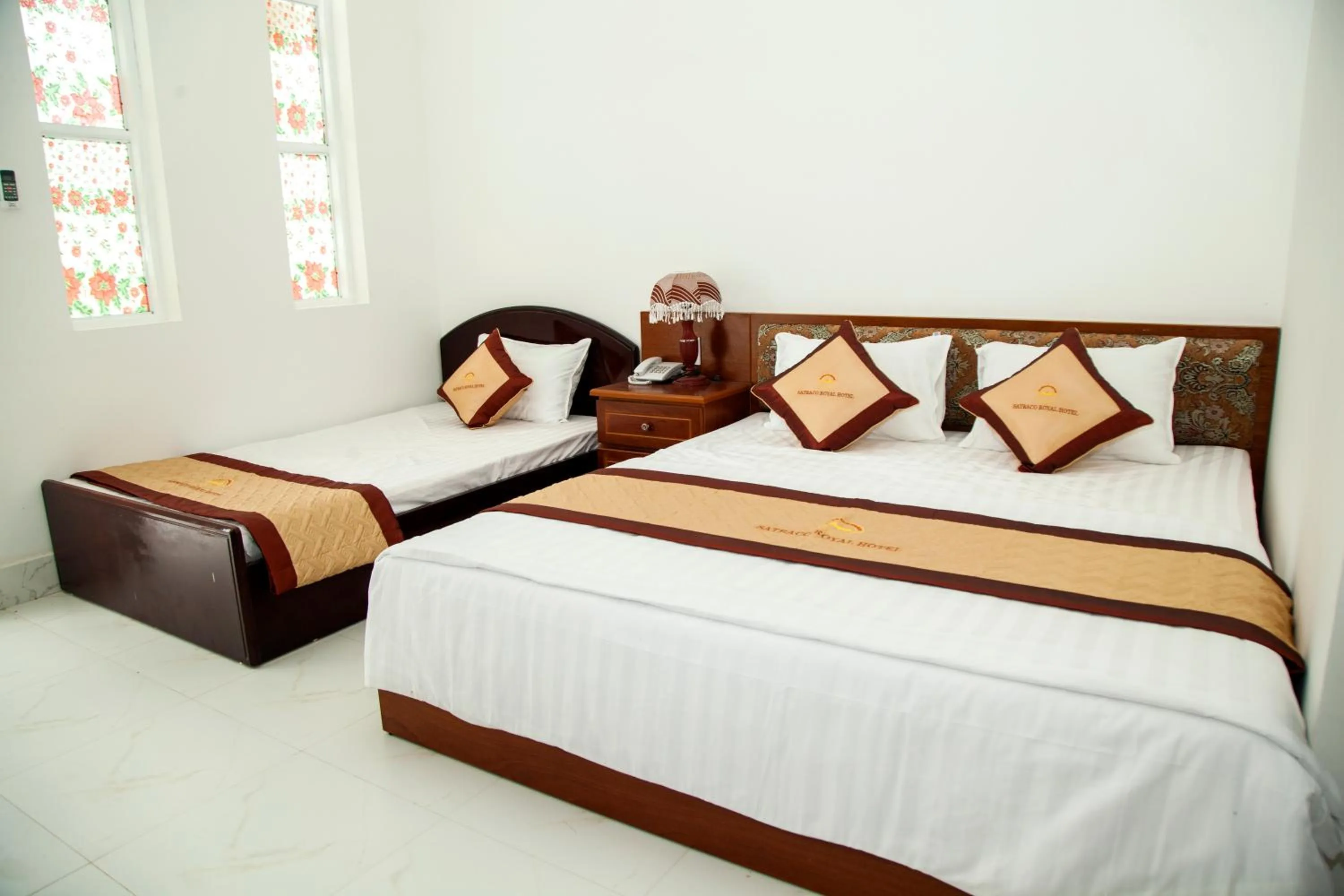 Bed in Satraco Royal Hotel