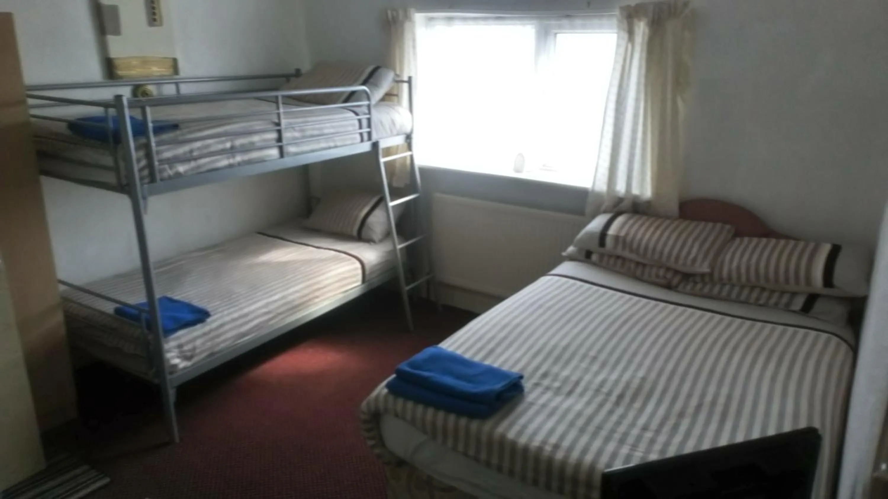 Bed in MyRoomz Golden Strand Hotel