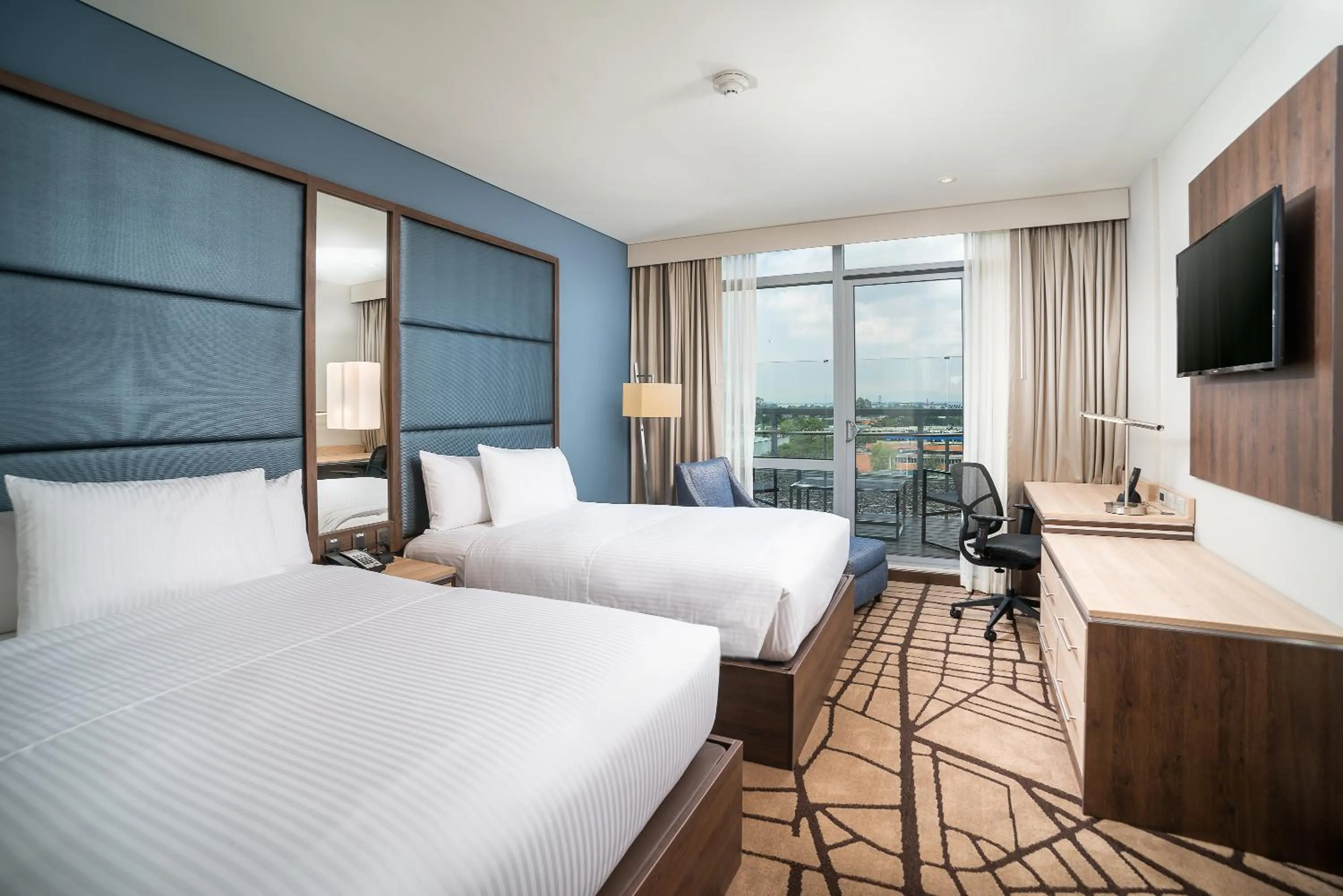 Balcony/Terrace, Bed in Hilton Garden Inn Bogota Airport