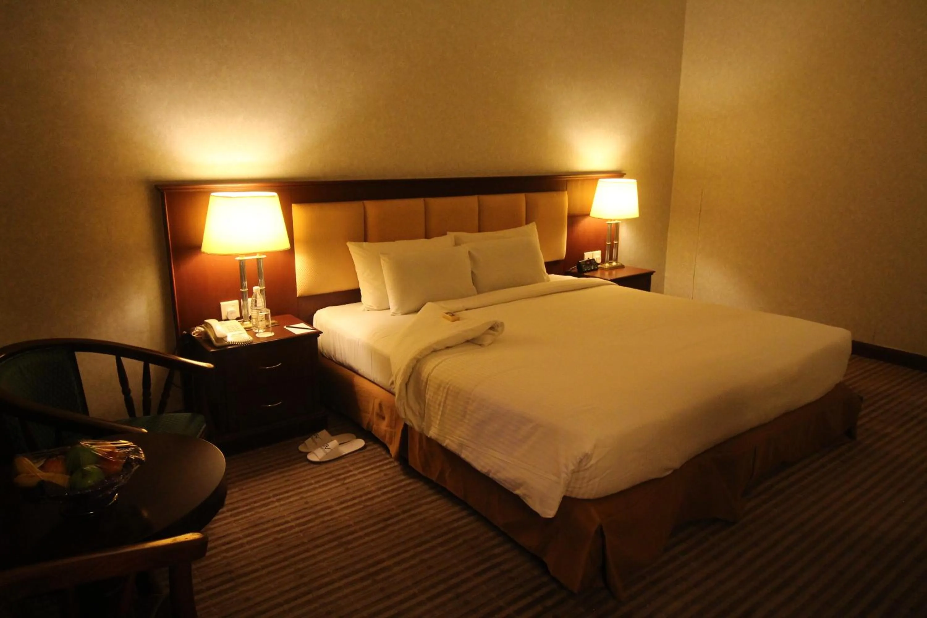 Bed in Grand Riverview Hotel