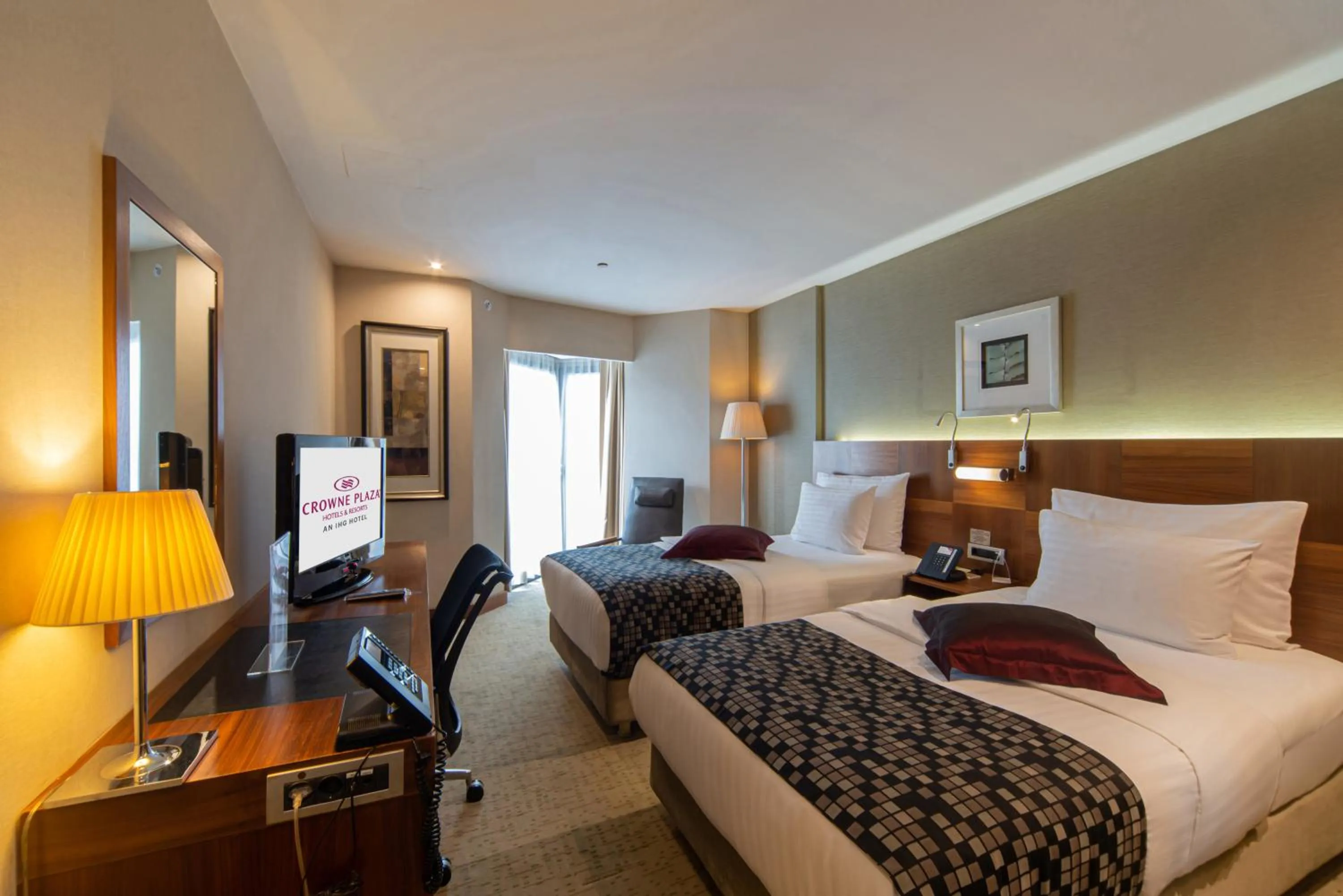 Bed in Crowne Plaza Istanbul Harbiye by IHG