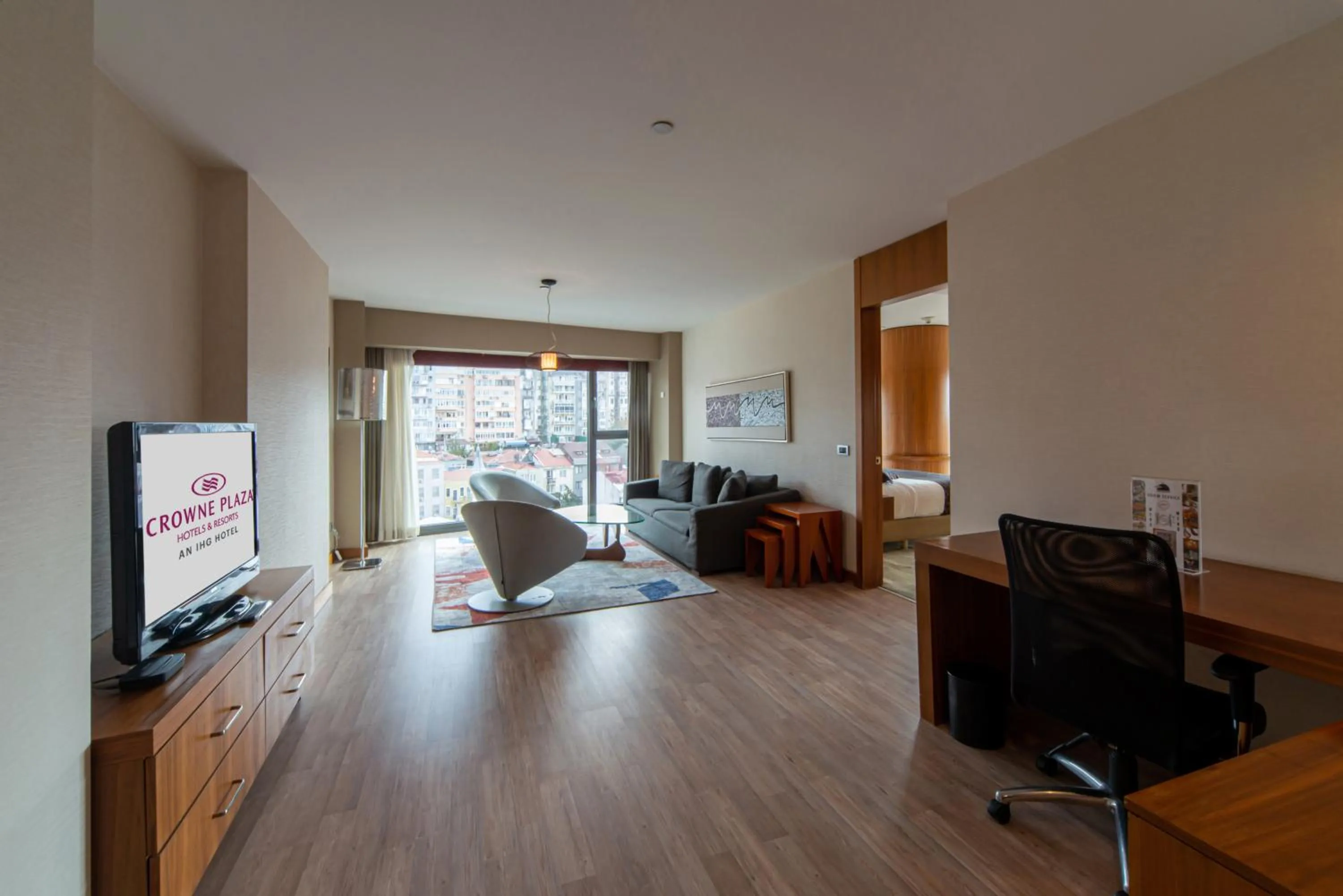 Communal lounge/ TV room in Crowne Plaza Istanbul Harbiye by IHG