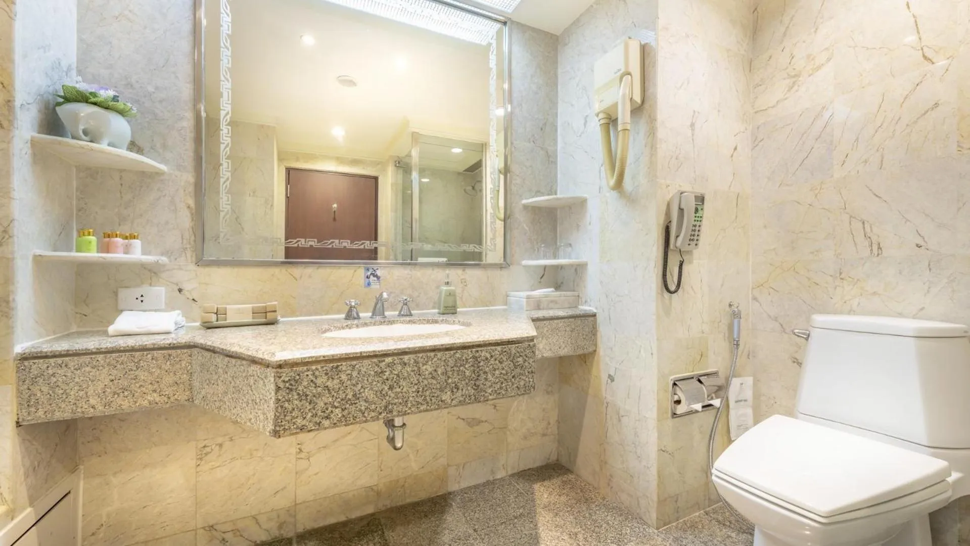 Bathroom in Ramada by Wyndham Bangkok Chaophya Park