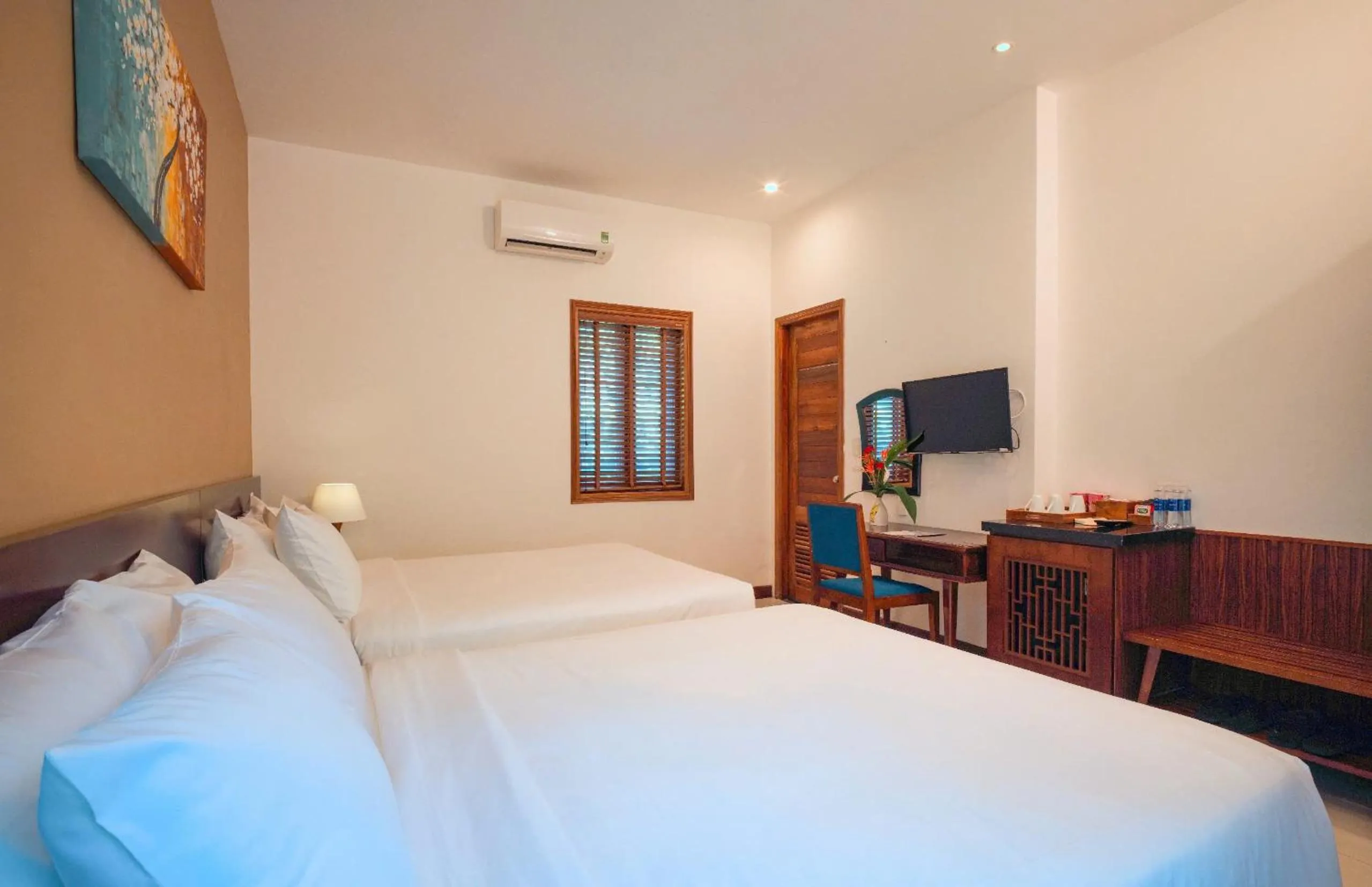Bed in Nadine Phu Quoc Resort & Spa
