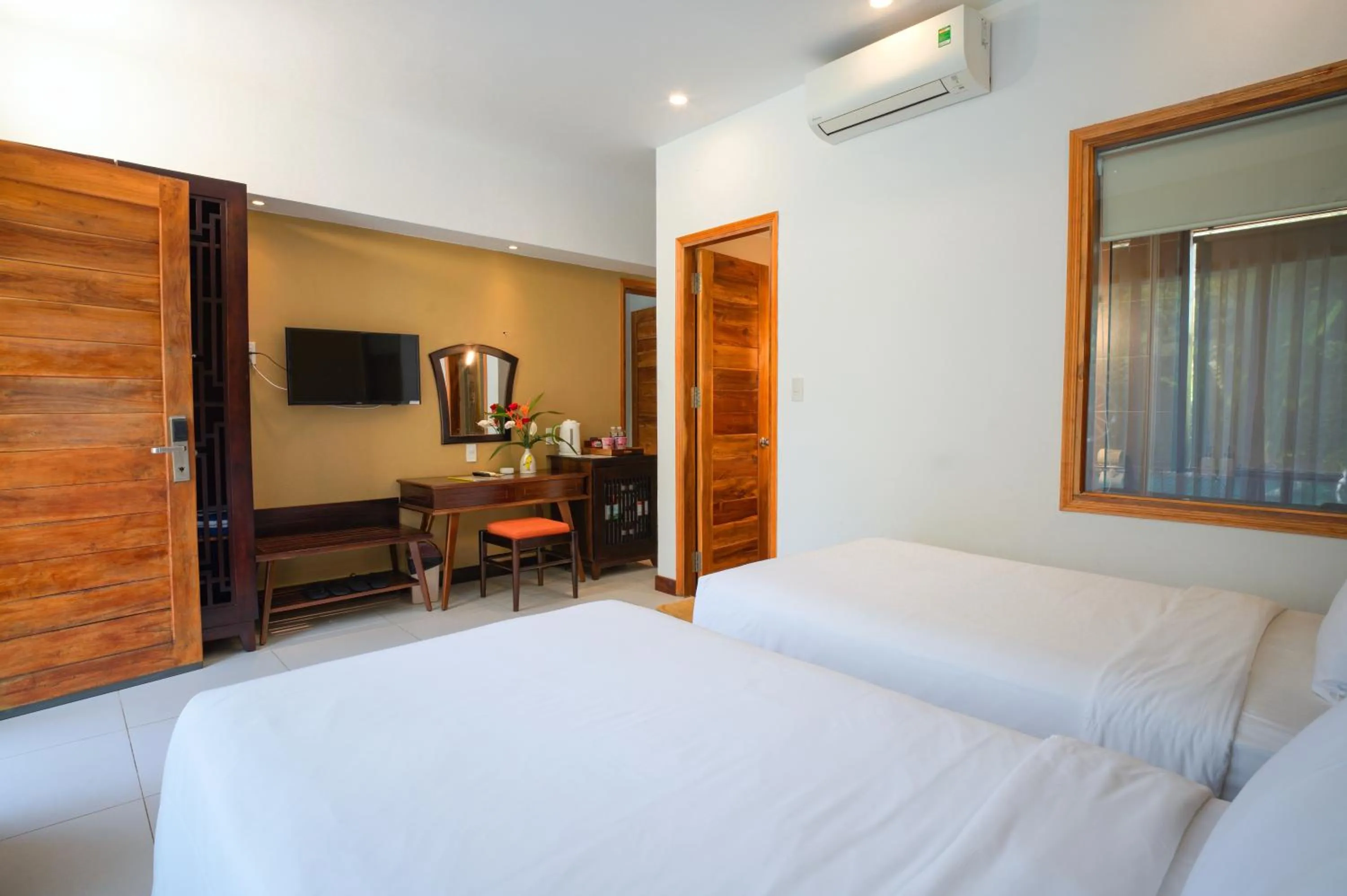 Bed in Nadine Phu Quoc Resort & Spa