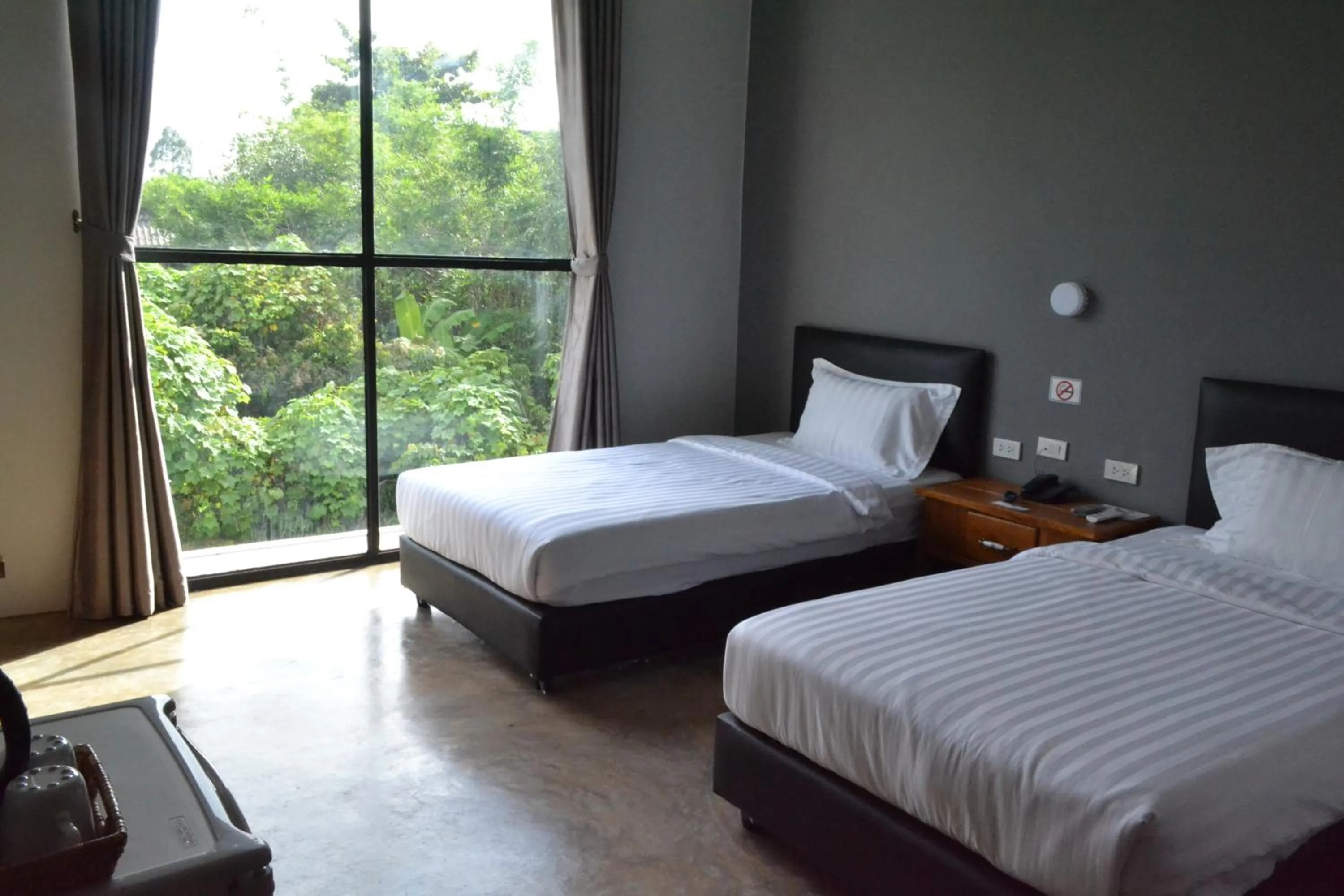 Bed in Nornlamphun Boutique Hotel