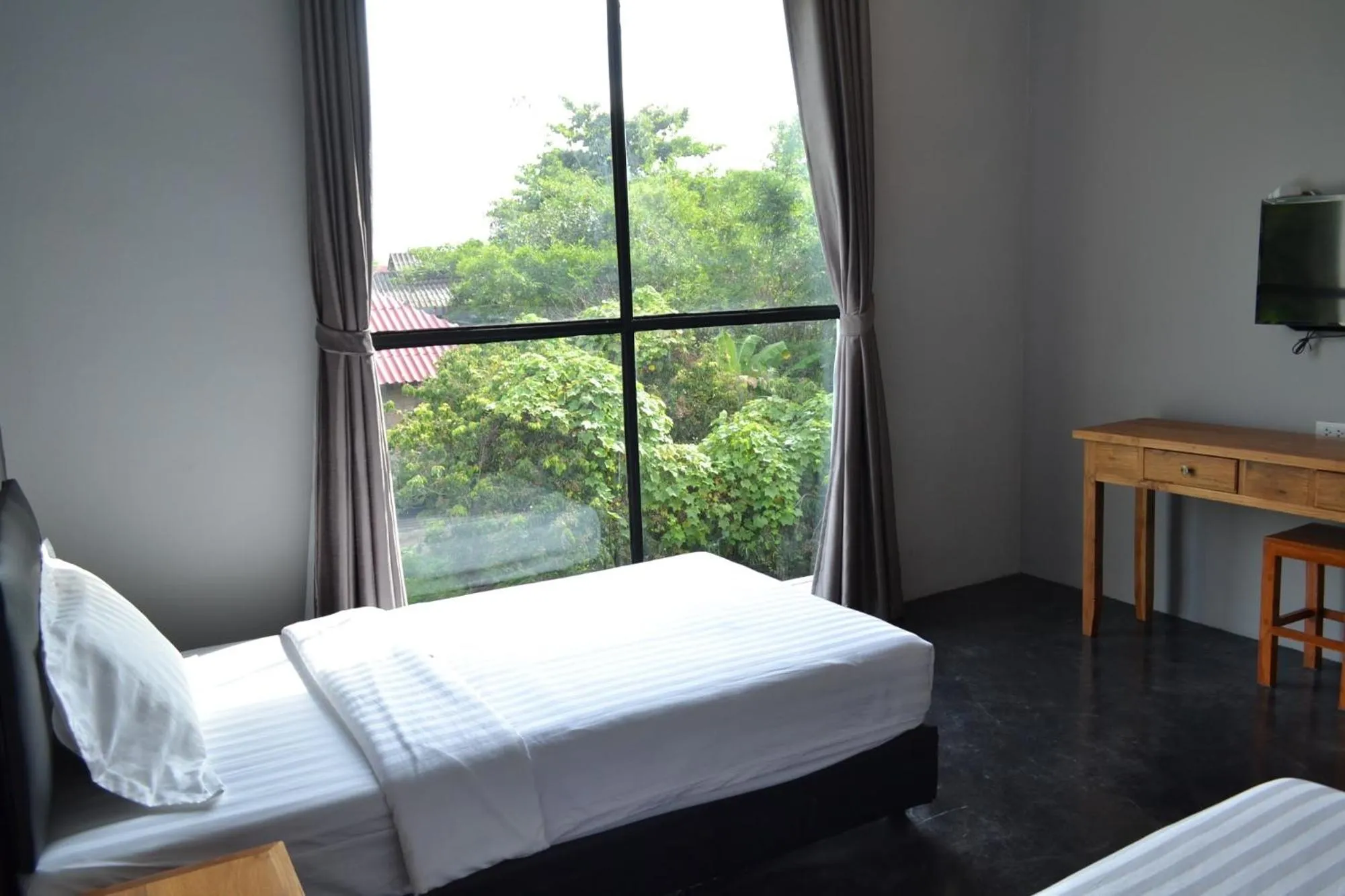 Bed in Nornlamphun Boutique Hotel