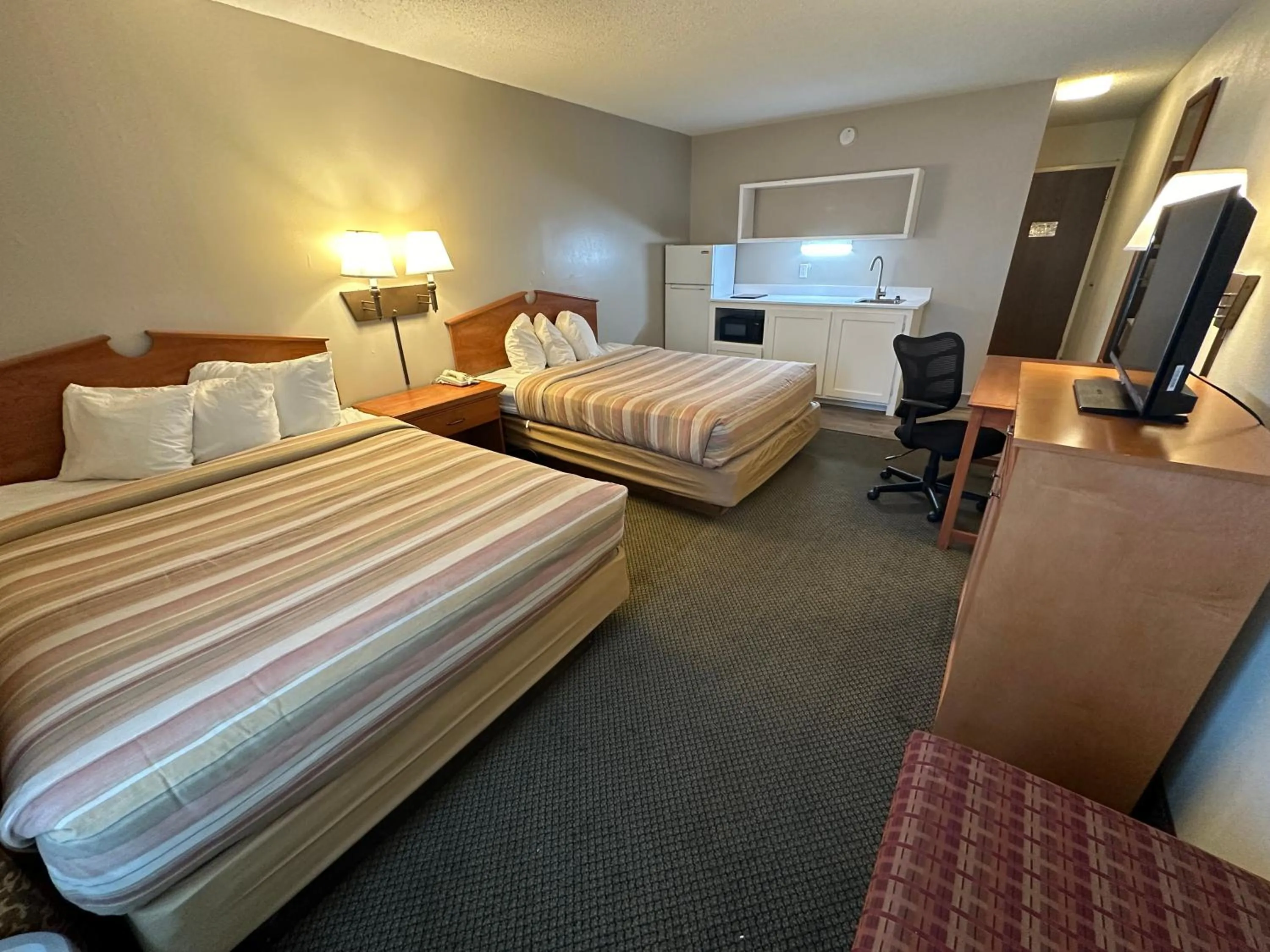 Guests, Bed in FairBridge Extended Stay, a Kitchenette Hotel