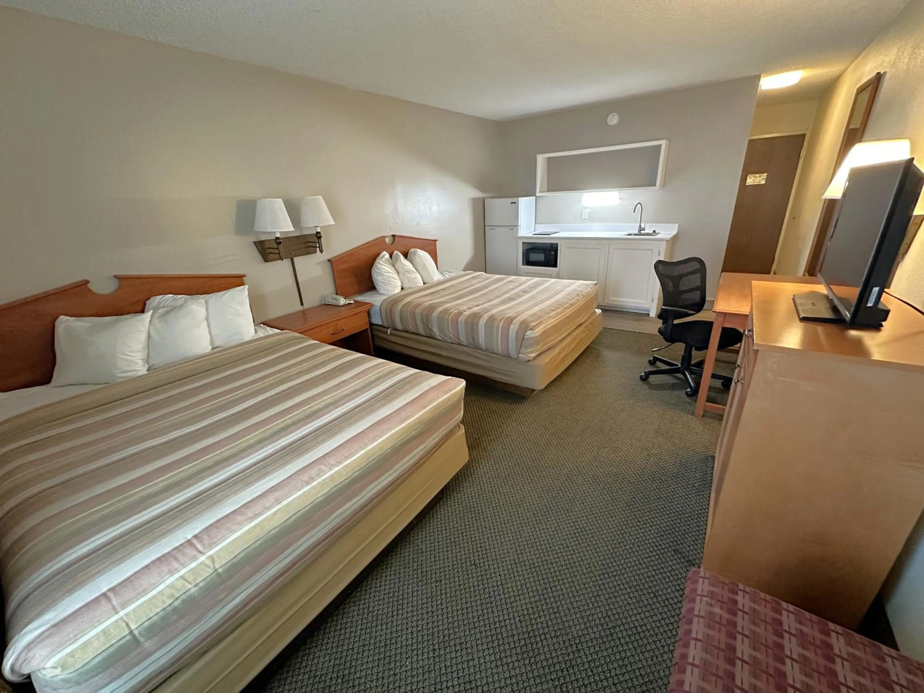 Guests, Bed in FairBridge Extended Stay, a Kitchenette Hotel