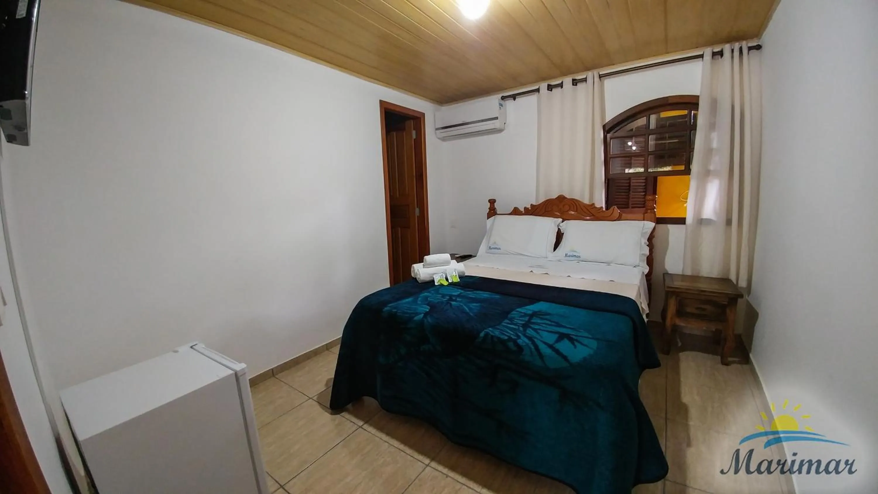 Bed in Pousada Marimar