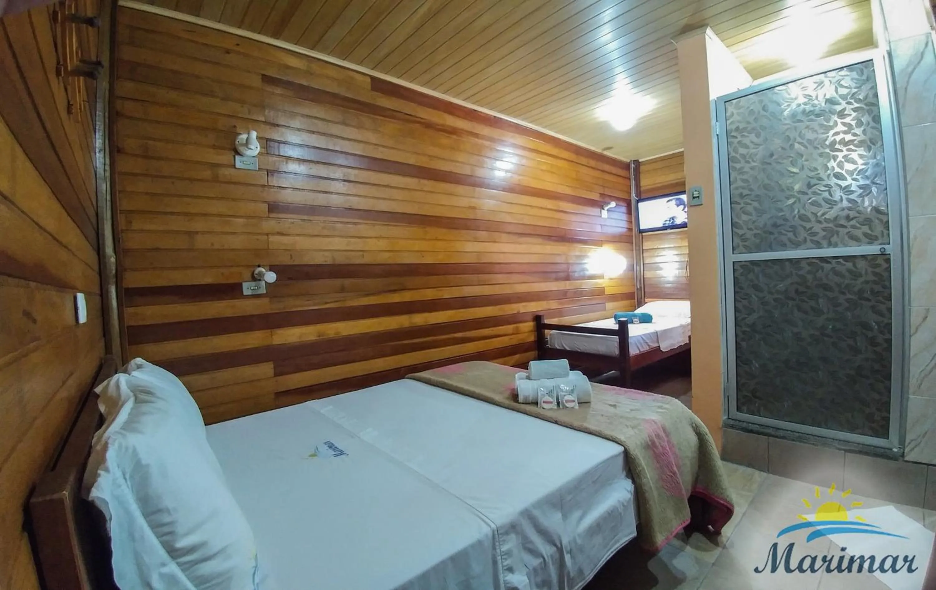 Bed in Pousada Marimar