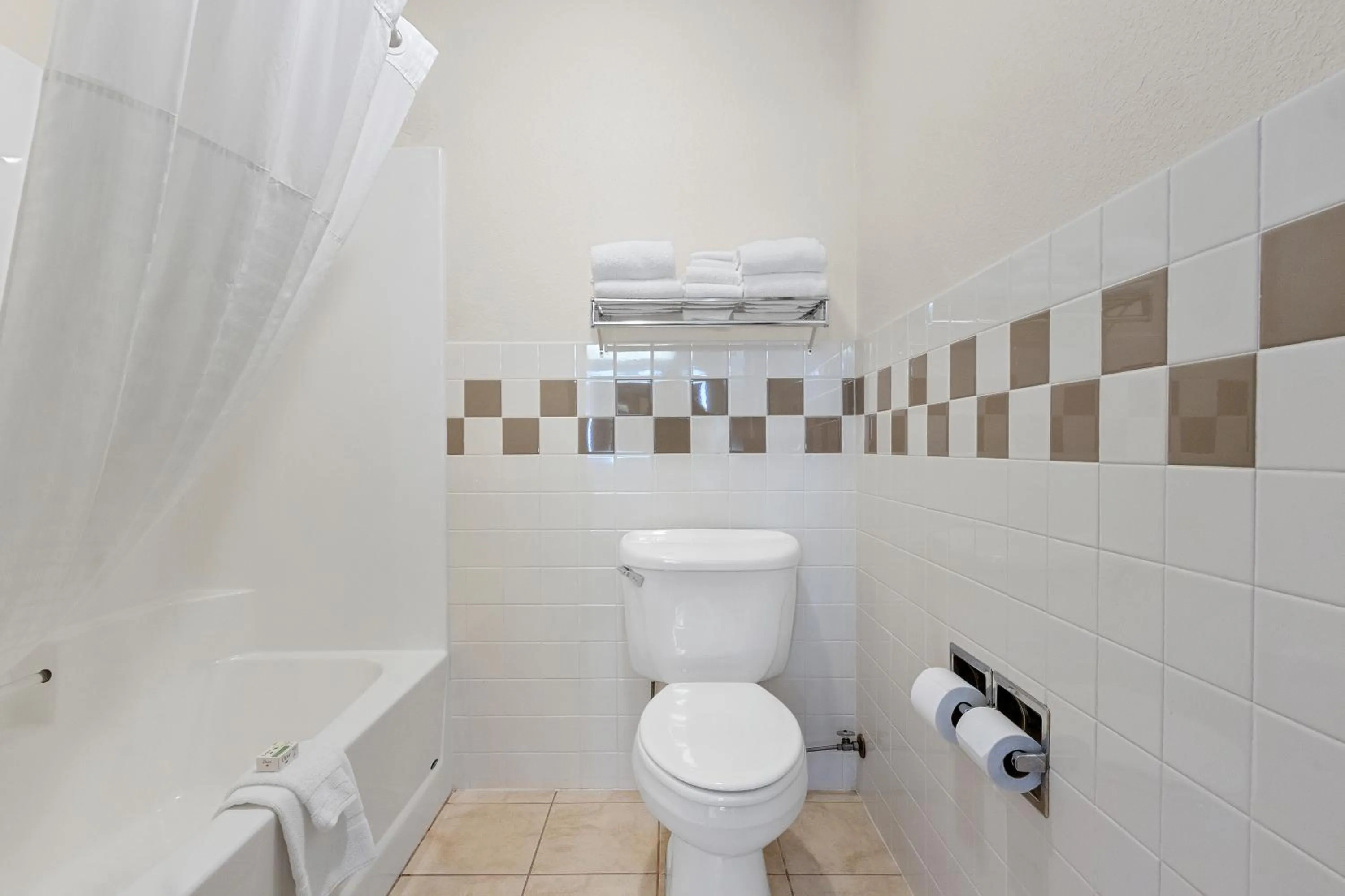 Toilet in AmericInn by Wyndham Green Bay East